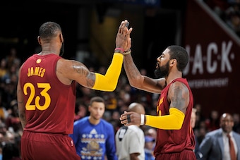 CLEVELAND, OH - DECEMBER 25:  Kyrie Irving #2 and LeBron James #23 of the Cleveland Cavaliers shake hands during the game against the Golden State Warriors on December 25, 2016 at Quicken Loans Arena in Cleveland, Ohio. NOTE TO USER: User expressly acknow