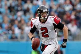 CHARLOTTE, NC - DECEMBER 24:  Matt Ryan #2 of the Atlanta Falcons runs the ball against the Carolina Panthers in the 3rd quarter during their game at Bank of America Stadium on December 24, 2016 in Charlotte, North Carolina.  (Photo by Streeter Lecka/Gett