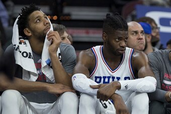 PHILADELPHIA, PA - DECEMBER 20: Jahlil Okafor #8 and Nerlens Noel #4 of the Philadelphia 76ers watch the game from the bench in the fourth quarter against the New Orleans Pelicans at Wells Fargo Center on December 20, 2016 in Philadelphia, Pennsylvania. T