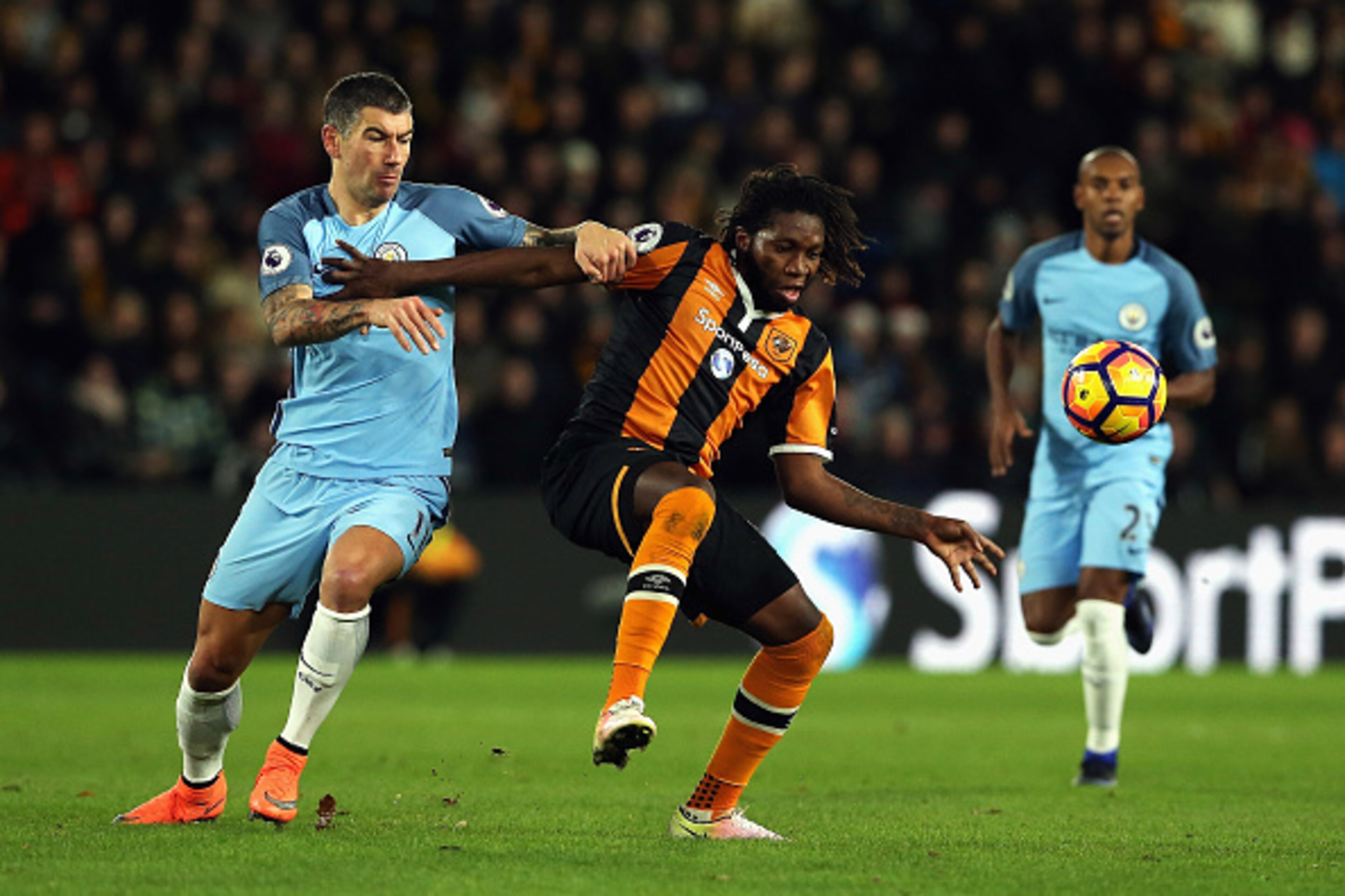 HULL, ENGLAND - DECEMBER 26: Dieumerci Mbokani of Hull City is challenged by Aleksandar Kolorov of Manchester City during the Premier League match between Hull City and Manchester City at KCOM Stadium on December 26, 2016 in Hull, England. (Photo by Nig HULL, ENGLAND - DECEMBER 26: Dieumerci Mbokani of Hull City is challenged by Aleksandar Kolorov of Manchester City during the Premier League match between Hull City and Manchester City at KCOM Stadium on December 26, 2016 in Hull, England. (Photo by Nig