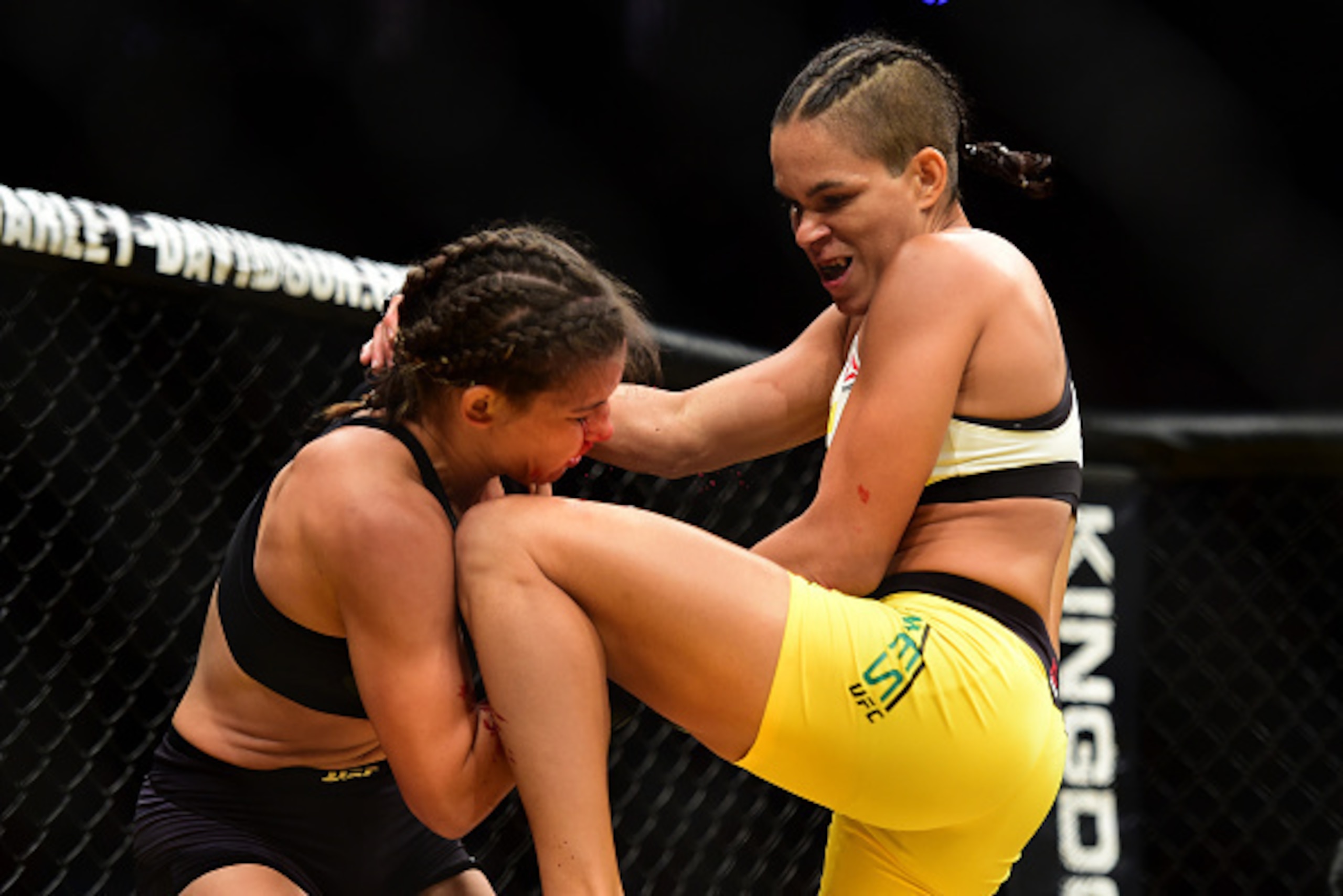 LAS VEGAS, NV - JULY 09: (R-L) Amanda Nunes of Brazil knees Miesha Tate in their UFC women's bantamweight championship bout during the UFC 200 event on July 9, 2016 at T-Mobile Arena in Las Vegas, Nevada.  (Photo by Harry How/Zuffa LLC/Zuffa LLC via Getty