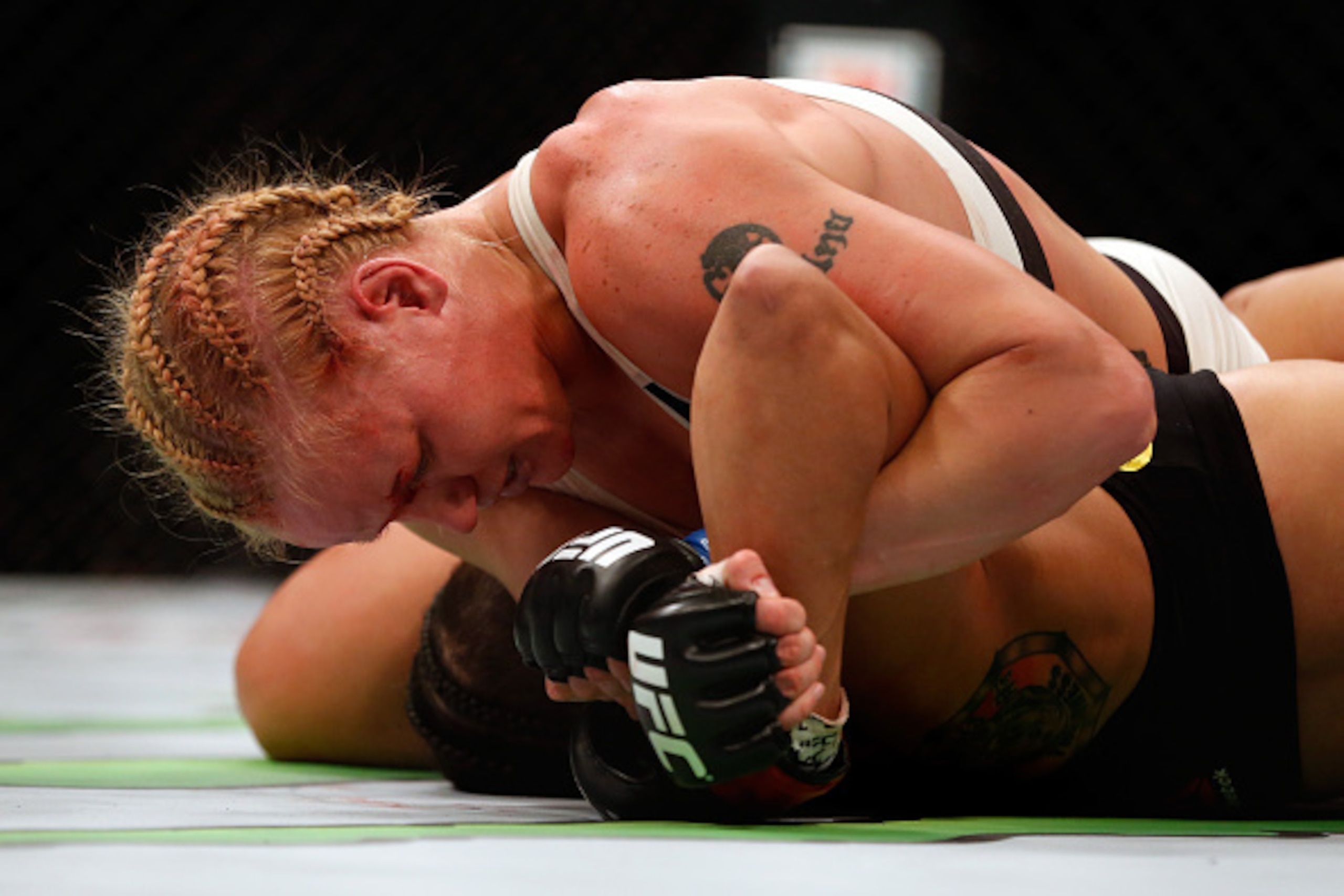 LAS VEGAS, NV - MARCH 05: Valentina Shevchenko of Peru (top) attempts to submit Amanda Nunes of Brazil in their women's bantamweight bout during the UFC 196 event inside MGM Grand Garden Arena on March 5, 2016 in Las Vegas, Nevada.  (Photo by Christian Pe