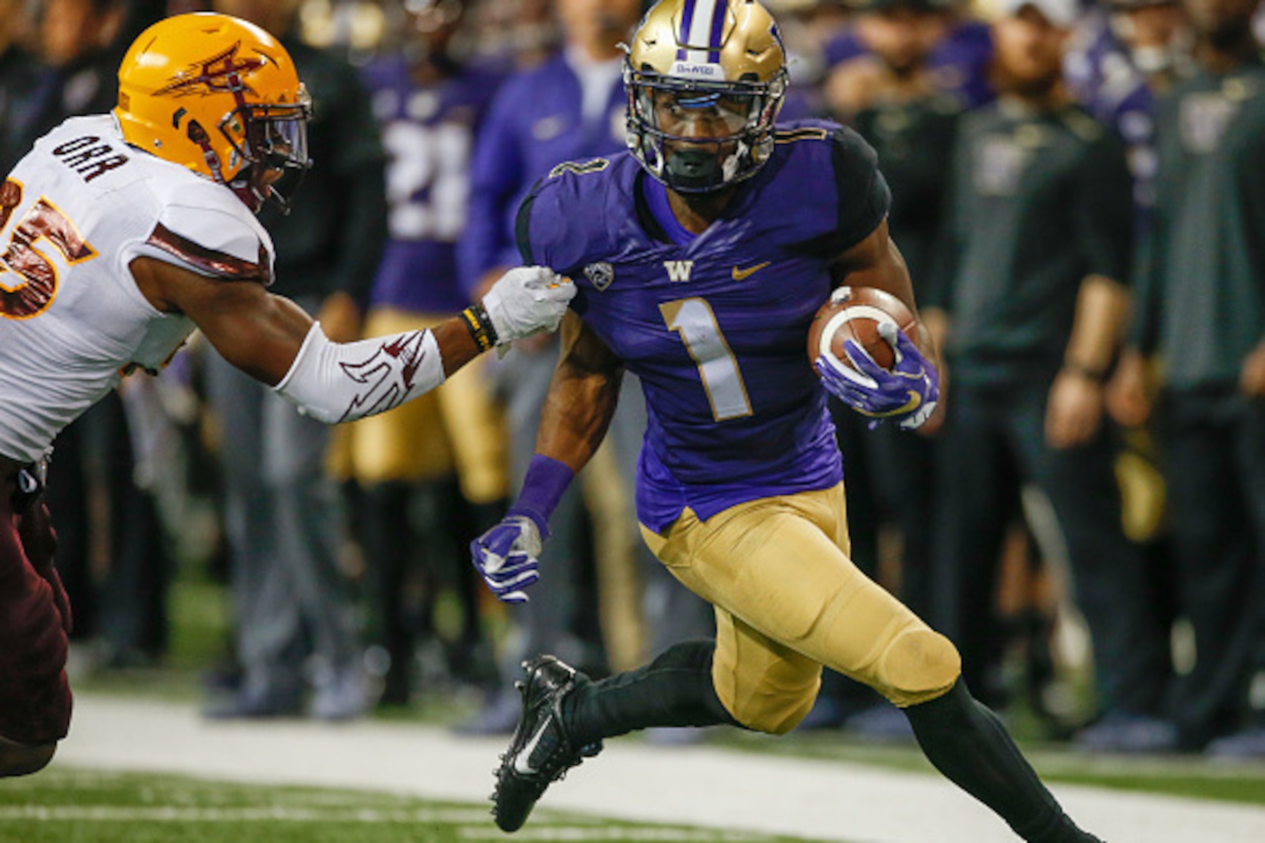 SEATTLE, WA - NOVEMBER 19:  Wide receiver John Ross #1 of the Washington Huskies rushes against defensive back Kareem Orr #25 of the Arizona State Sun Devils on November 19, 2016 at Husky Stadium in Seattle, Washington. The Huskies defeated the Sun Devils