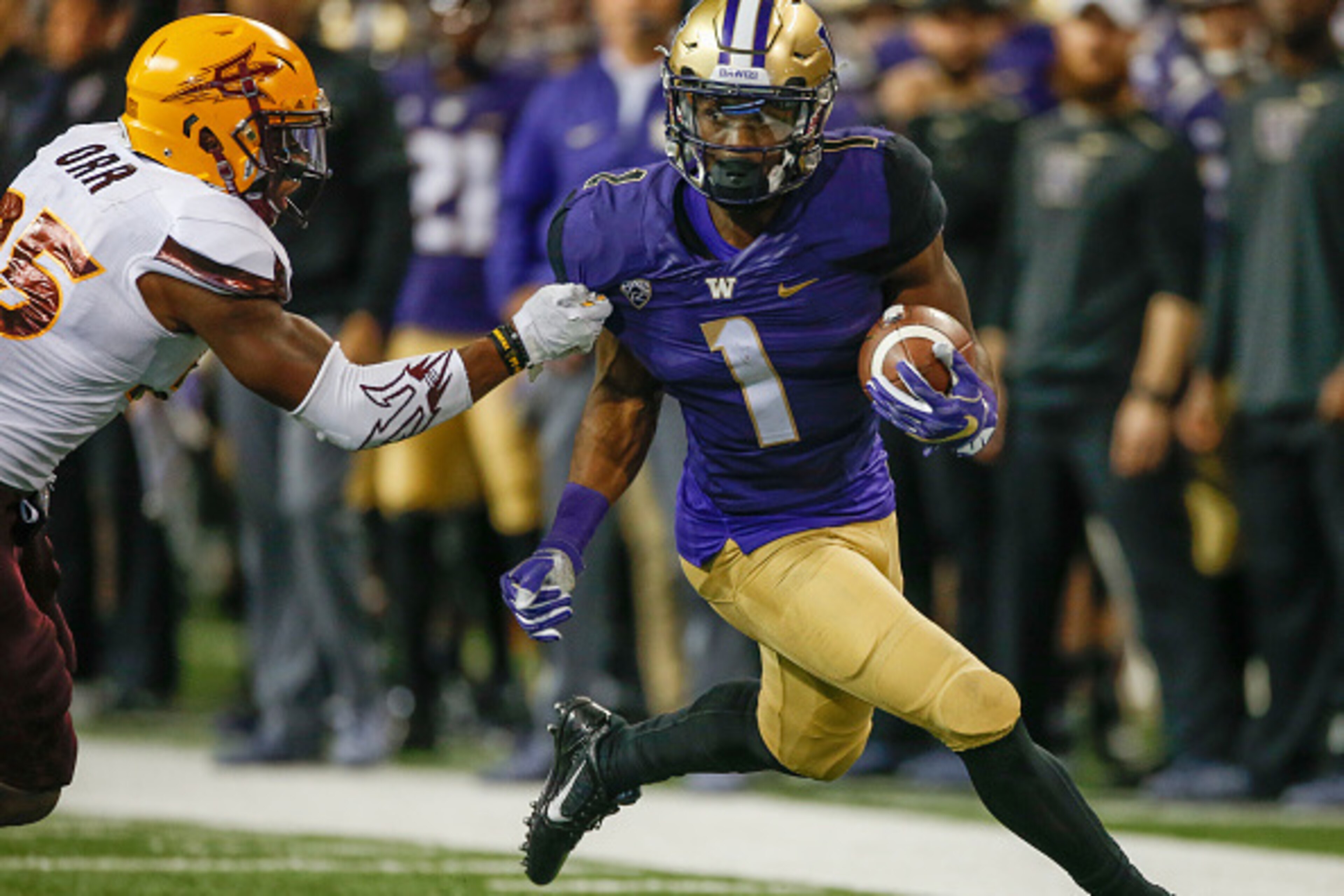 SEATTLE, WA - NOVEMBER 19:  Wide receiver John Ross #1 of the Washington Huskies rushes against defensive back Kareem Orr #25 of the Arizona State Sun Devils on November 19, 2016 at Husky Stadium in Seattle, Washington. The Huskies defeated the Sun Devils