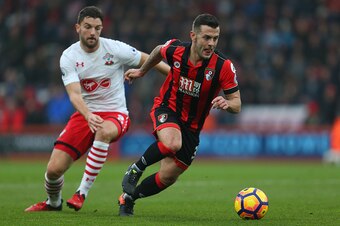 BOURNEMOUTH, ENGLAND - DECEMBER 18: Jack Wilshere of Bournemouth gets past Jay Rodriguez of Southampton during the Premier League match between AFC. Bournemouth and Southampton at Vitality Stadium on December 18, 2016 in Bournemouth, England. (Photo by Ca