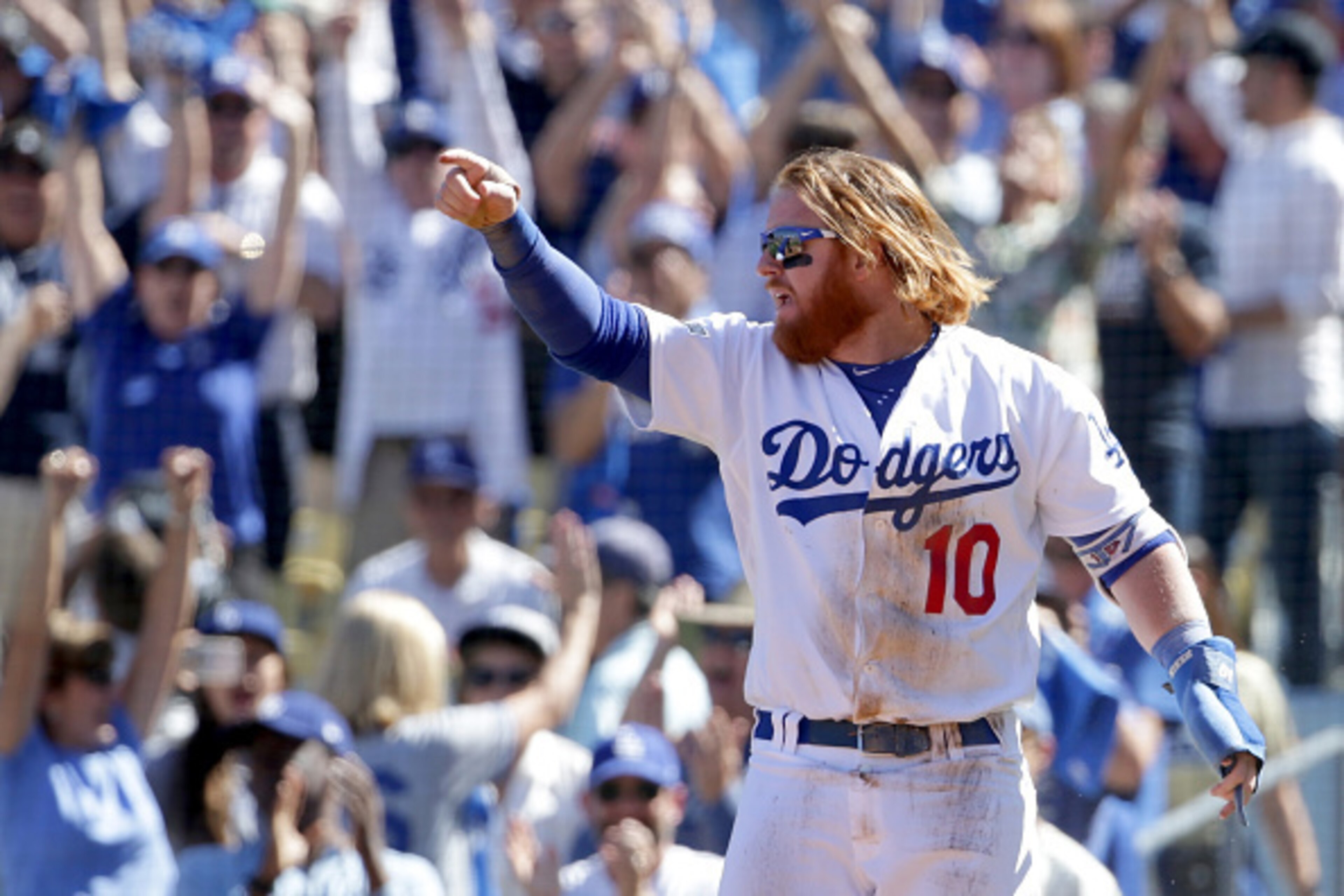 LOS ANGELES, CA - OCTOBER 10:  Justin Turner #10 of the Los Angeles Dodgers celebrates after scoring a run in the first inning against the Washington Nationals in game three of the National League Division Series at Dodger Stadium on October 10, 2016 in L