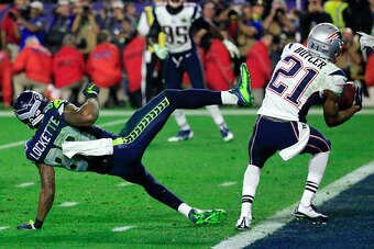 GLENDALE, AZ - FEBRUARY 01:  Malcolm Butler #21 of the New England Patriots intercepts a pass by  Russell Wilson #3 of the Seattle Seahawks intended for  Ricardo Lockette #83 late in the fourth quarter during Super Bowl XLIX at University of Phoenix Stadi
