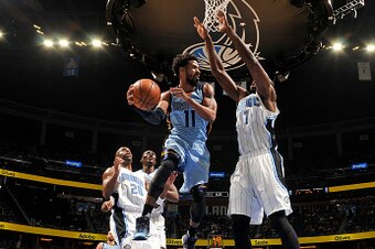 ORLANDO, FL - DECEMBER 26: Mike Conley #11 of the Memphis Grizzlies looks to pass against the Orlando Magic on December 26, 2016 at Amway Center in Orlando, Florida. NOTE TO USER: User expressly acknowledges and agrees that, by downloading and or using th