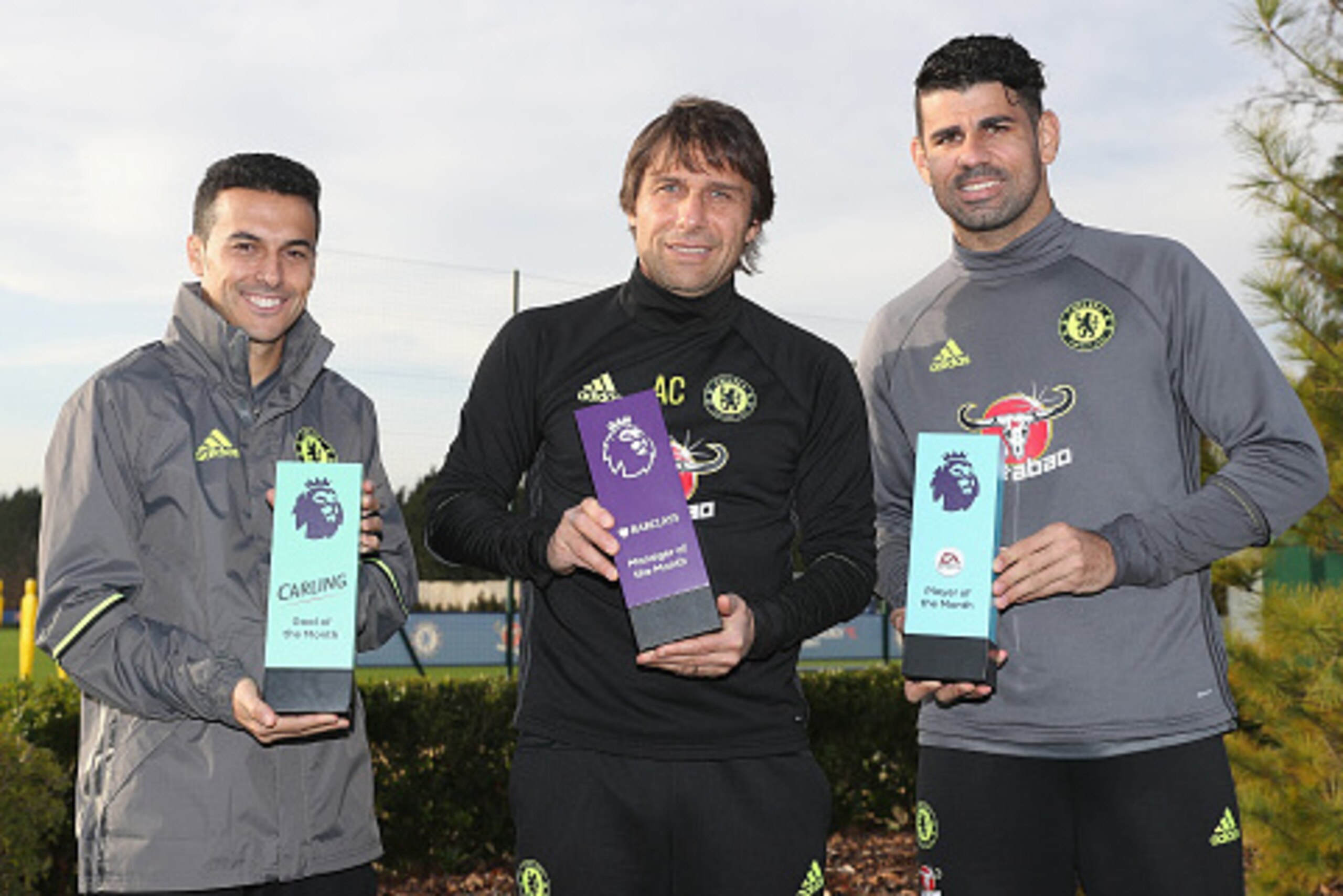 COBHAM, ENGLAND - DECEMBER 09:  Pedro, Manager Antonio Conte and Diego Costa pose with their awards as they receive the Monthly Premier League Awards at Chelsea Training Ground on December 9, 2016 in Cobham, England.  (Photo by Christopher Lee/Getty Image