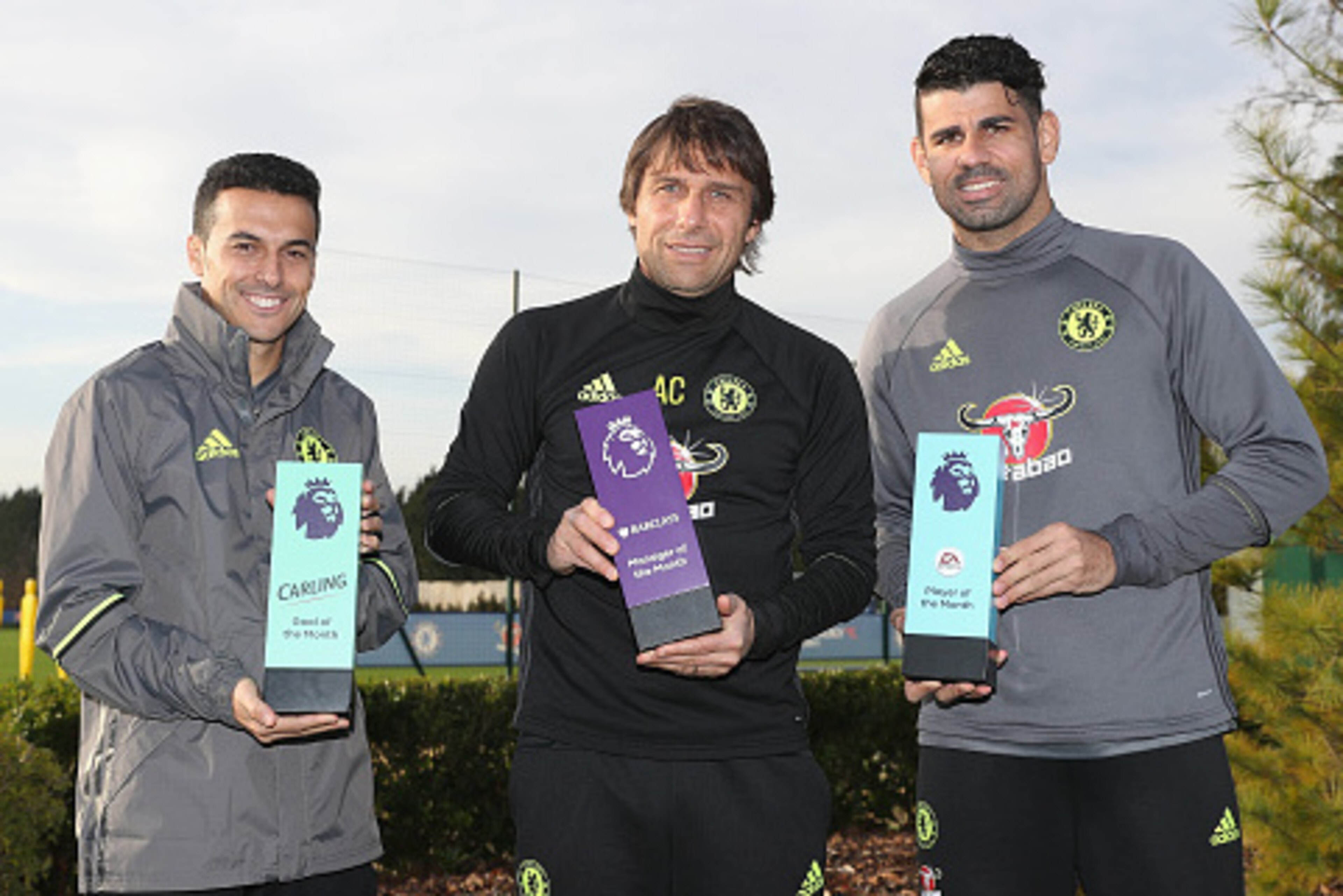 COBHAM, ENGLAND - DECEMBER 09:  Pedro, Manager Antonio Conte and Diego Costa pose with their awards as they receive the Monthly Premier League Awards at Chelsea Training Ground on December 9, 2016 in Cobham, England.  (Photo by Christopher Lee/Getty Image