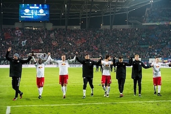 Players of RB Leipzig celebrate after the German first division Bundesliga football match between RB Leipzig and Schalke 04 in Leipzig, eastern Germany on December 3, 2016.  / AFP / JENS SCHLUTER / RESTRICTIONS: DURING MATCH TIME: DFL RULES TO LIMIT THE O