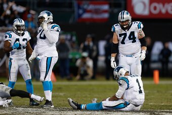 OAKLAND, CA - NOVEMBER 27: Cam Newton #1 of the Carolina Panthers sits on the ground after failing to convert on a fourth-down attempt lat in the fourth quarter against the Oakland Raiders on November 27, 2016 in Oakland, California. (Photo by Lachlan Cun