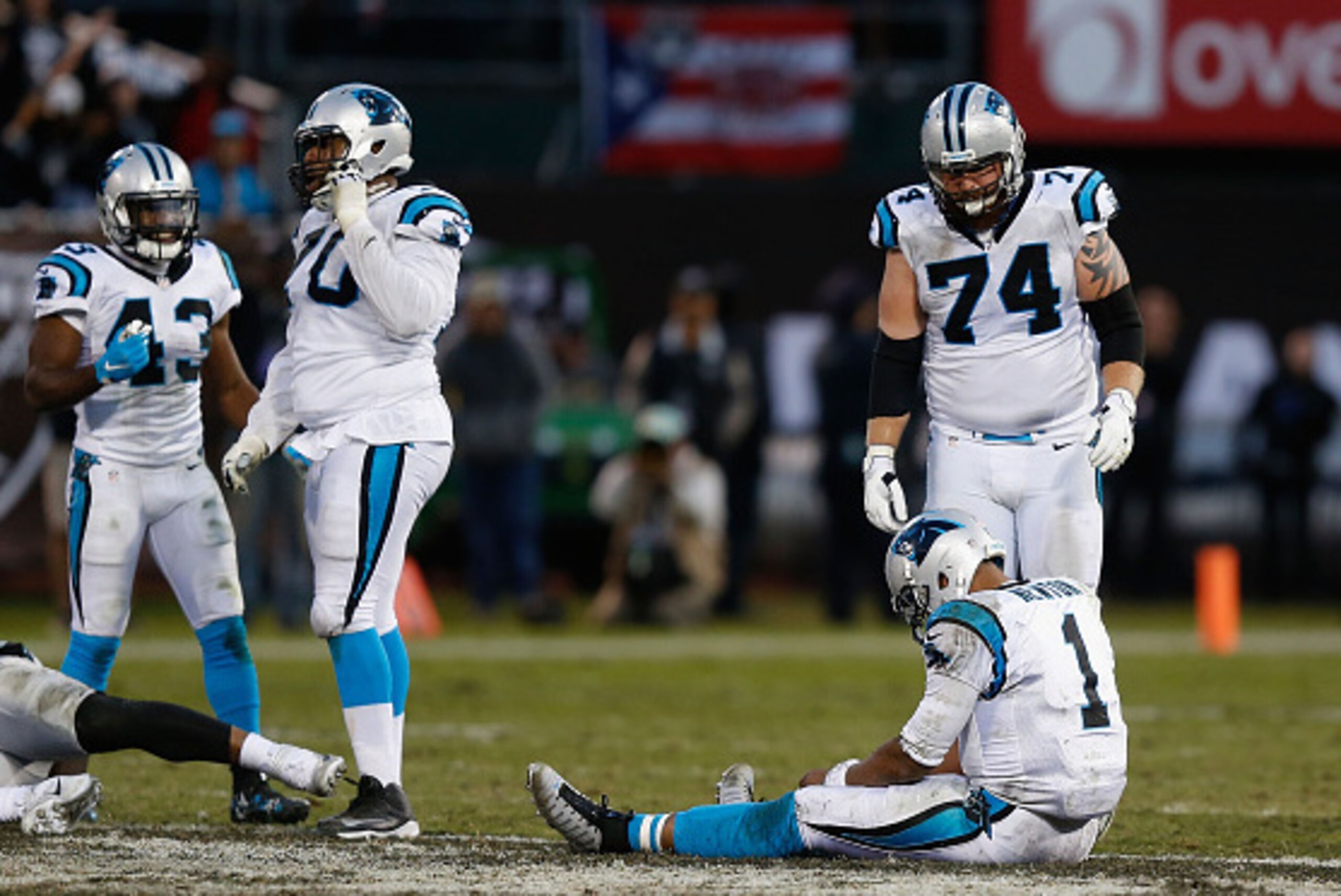 OAKLAND, CA - NOVEMBER 27: Cam Newton #1 of the Carolina Panthers sits on the ground after failing to convert on a fourth-down attempt lat in the fourth quarter against the Oakland Raiders on November 27, 2016 in Oakland, California. (Photo by Lachlan Cun
