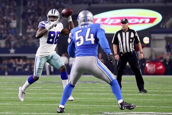 ARLINGTON, TX - DECEMBER 26:  Dez Bryant #88 of the Dallas Cowboys throws a touchdown pass to Jason Witten #82 of the Dallas Cowboys against DeAndre Levy #54 of the Detroit Lions in the third quarter at AT&T Stadium on December 26, 2016 in Arlington, Texa