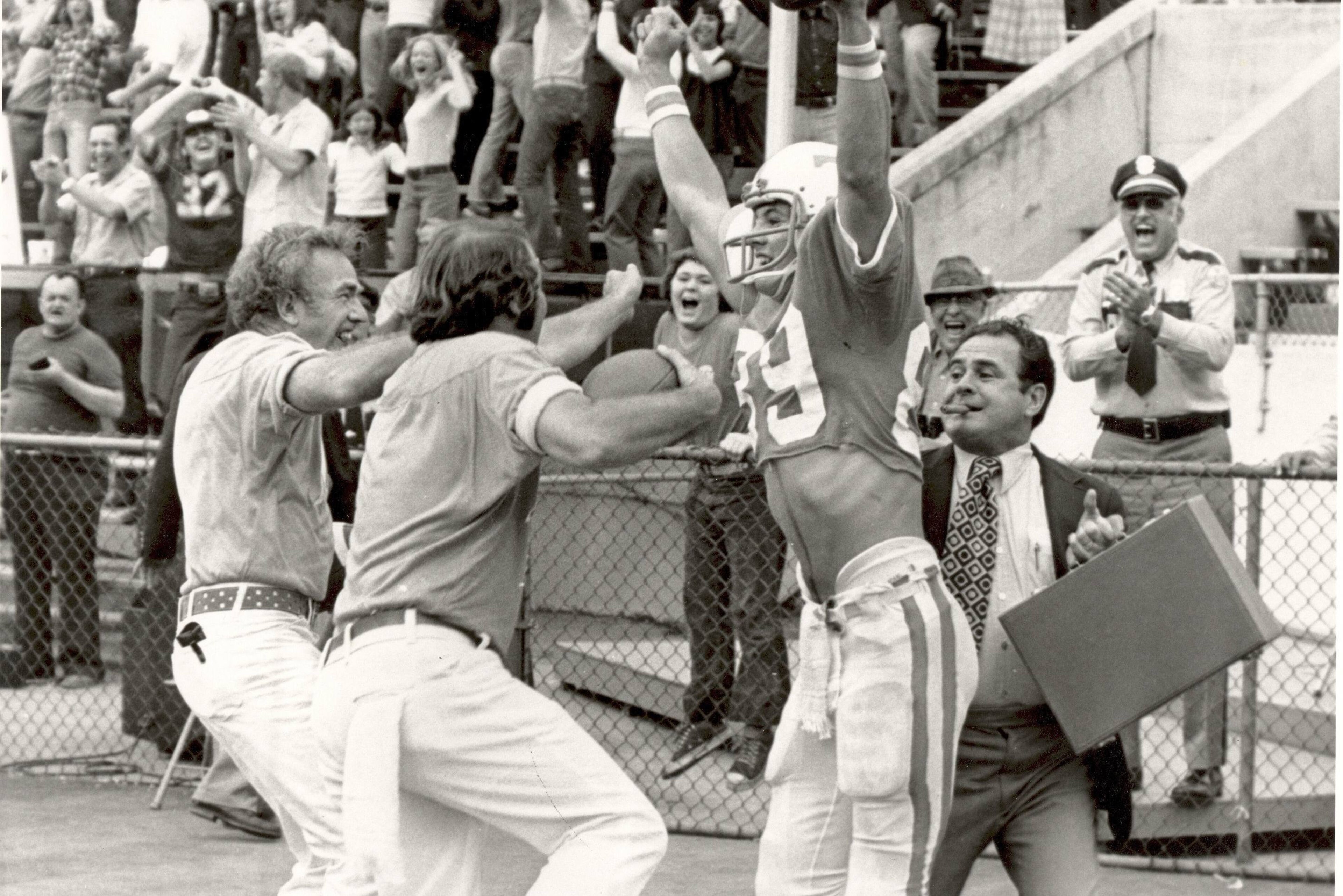 Manning (far right) celebrates a touchdown with receiver Larry Seivers after his game-winning two-point conversion catch from Condredge Holloway to beat Clemson 29-28 in 1974. Manning (far right) celebrates a touchdown with receiver Larry Seivers after his game-winning two-point conversion catch from Condredge Holloway to beat Clemson 29-28 in 1974.