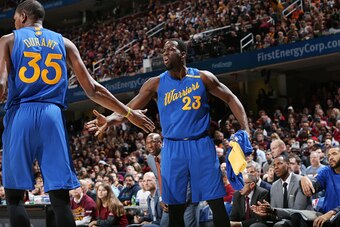 CLEVELAND, OH - DECEMBER 25:  Draymond Green #23 and Kevin Durant #35 of the Golden State Warriors shake hands during the game against the Cleveland Cavaliers on December 25, 2016 at Quicken Loans Arena in Cleveland, Ohio. NOTE TO USER: User expressly ack