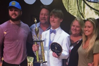 Cameron Boulware (center) with, from left, Ben, father Jamie, mother Krystal and sister Bailee.