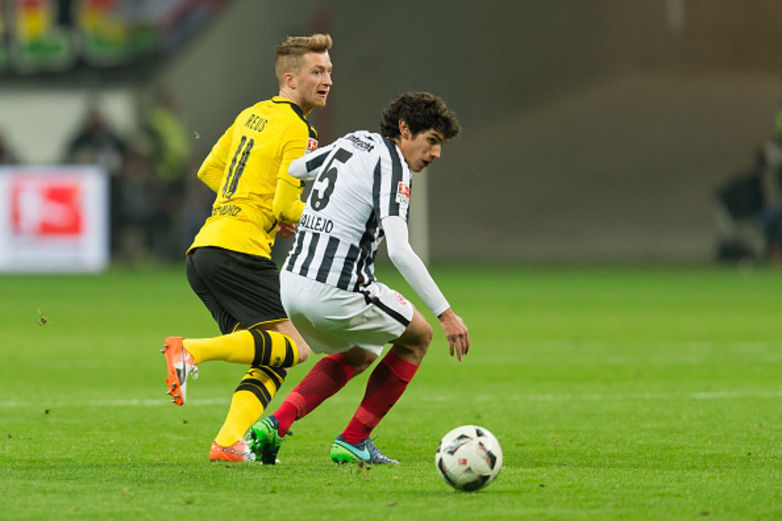 FRANKFURT, GERMANY - NOVEMBER 26: Marco Reus of Borussia Dortmund and Jesus Vallejo of Eintracht Frankfurt battle for the ball during the Bundesliga match between Eintracht Frankfurt and Borussia Dortmund at Commerzbank Arena on November 26, 2016 in Frank