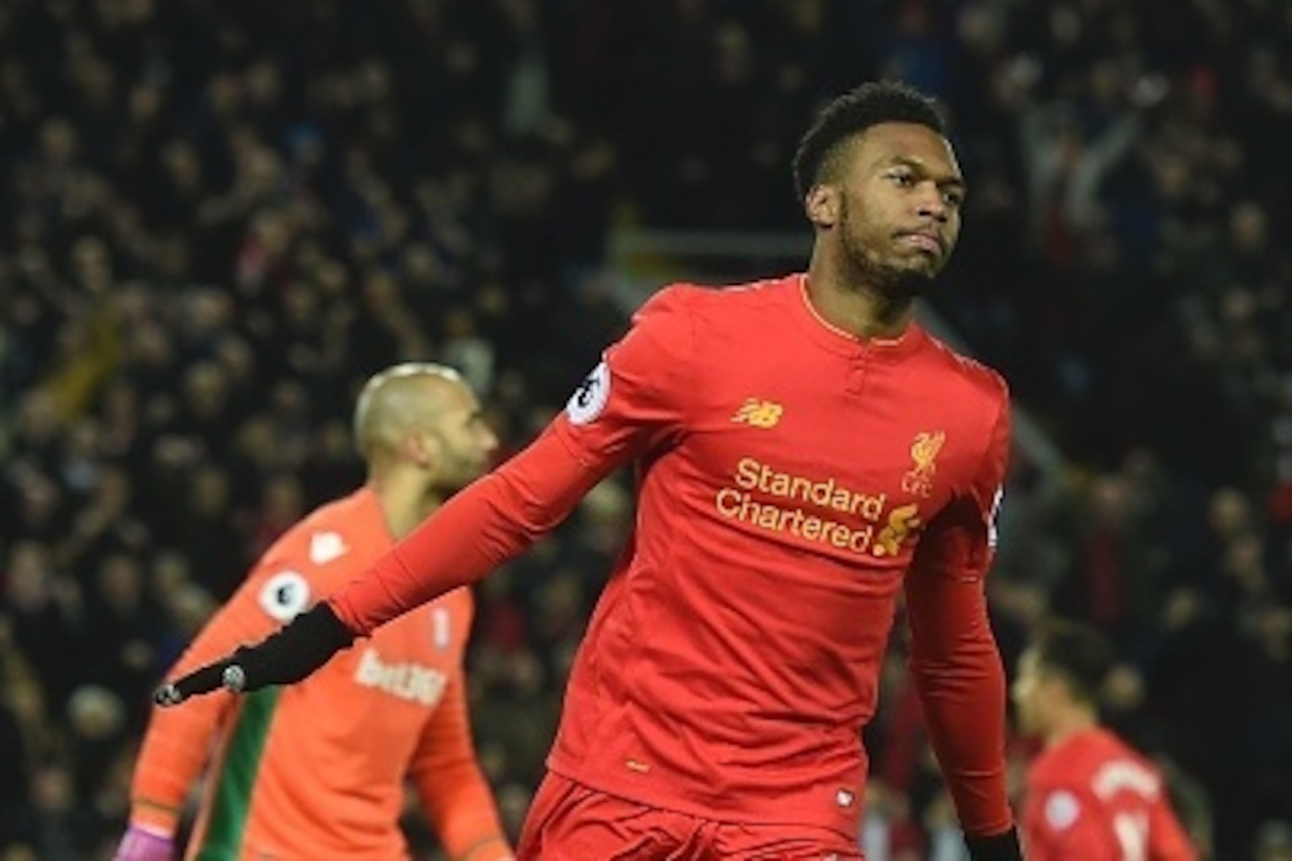 Liverpool's English striker Daniel Sturridge celebrates scoring their fourth goal during the English Premier League football match between Liverpool and Stoke City at Anfield in Liverpool, north west England on December 27, 2016. / AFP / Paul ELLIS / REST