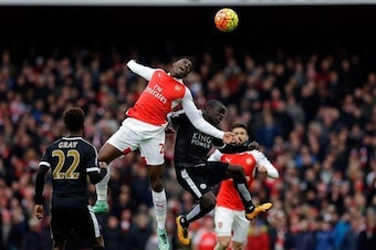 Danny Welbeck heads home Arsenal's winner against Leicester City in February.