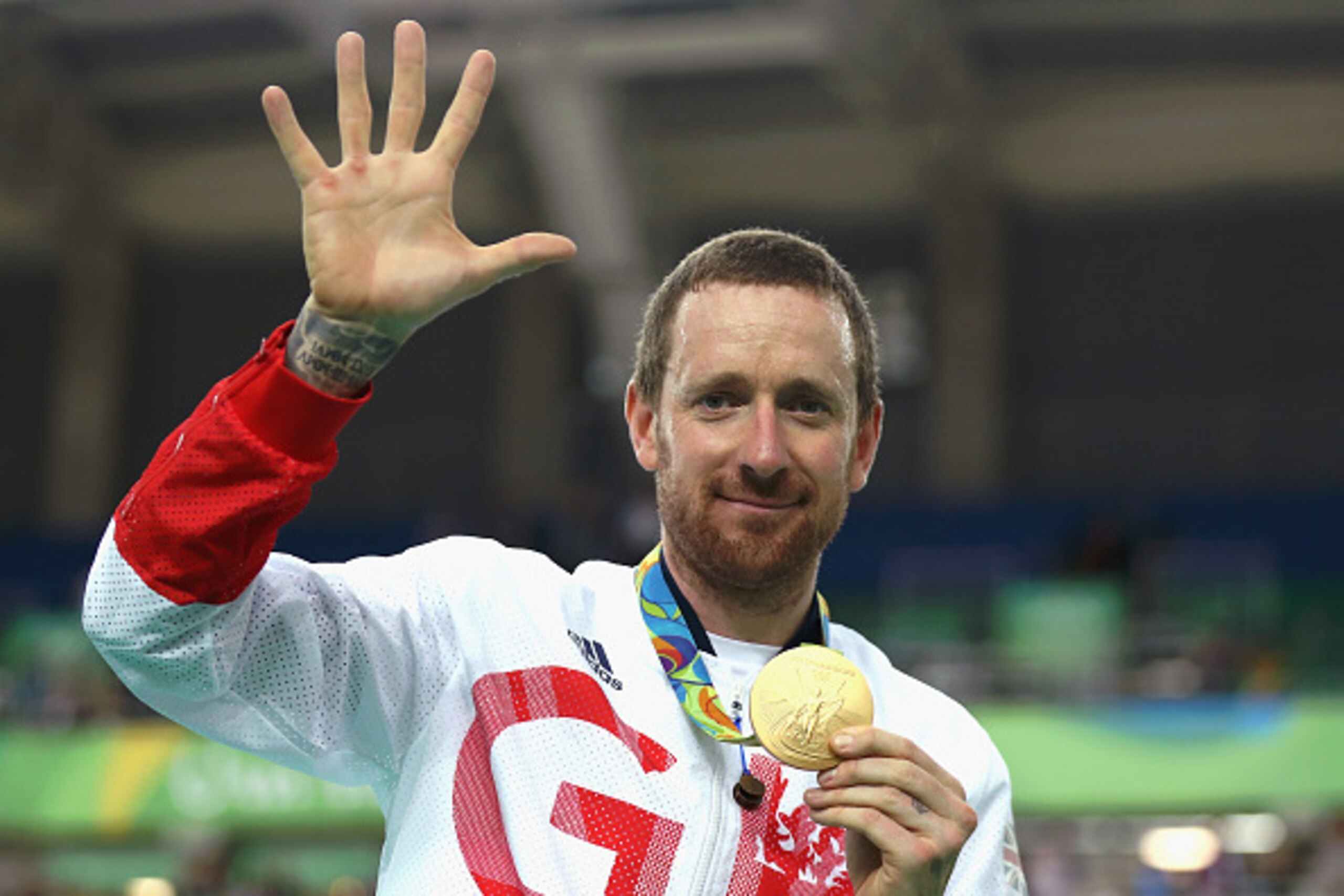 RIO DE JANEIRO, BRAZIL - AUGUST 12:  Gold medalist Bradley Wiggins of Team Great Britain poses for photographs with his fifth gold medal in his career after at the medal ceremony for the Men's Team Pursuit on Day 7 of the Rio 2016 Olympic Games at the Rio
