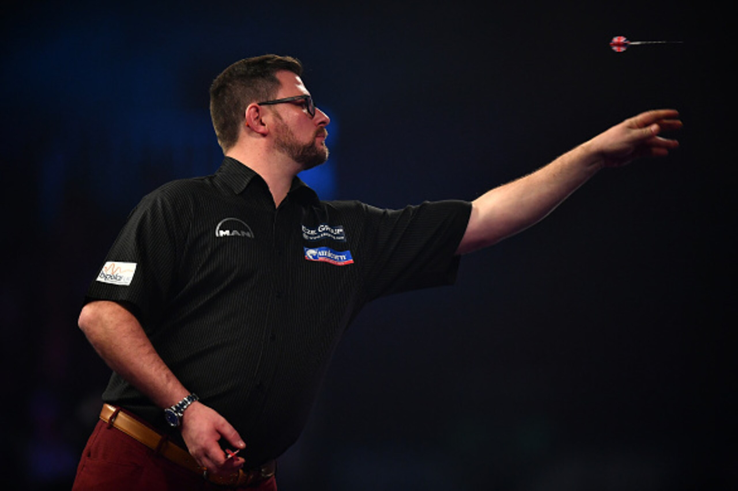 LONDON, ENGLAND - DECEMBER 21: James Wade of England throws during his first round match against Ronny Huybrechts of Belgium on day seven of the 2017 William Hill PDC World Darts Championships at Alexandra Palace on December 21, 2016 in London, England. LONDON, ENGLAND - DECEMBER 21: James Wade of England throws during his first round match against Ronny Huybrechts of Belgium on day seven of the 2017 William Hill PDC World Darts Championships at Alexandra Palace on December 21, 2016 in London, England.