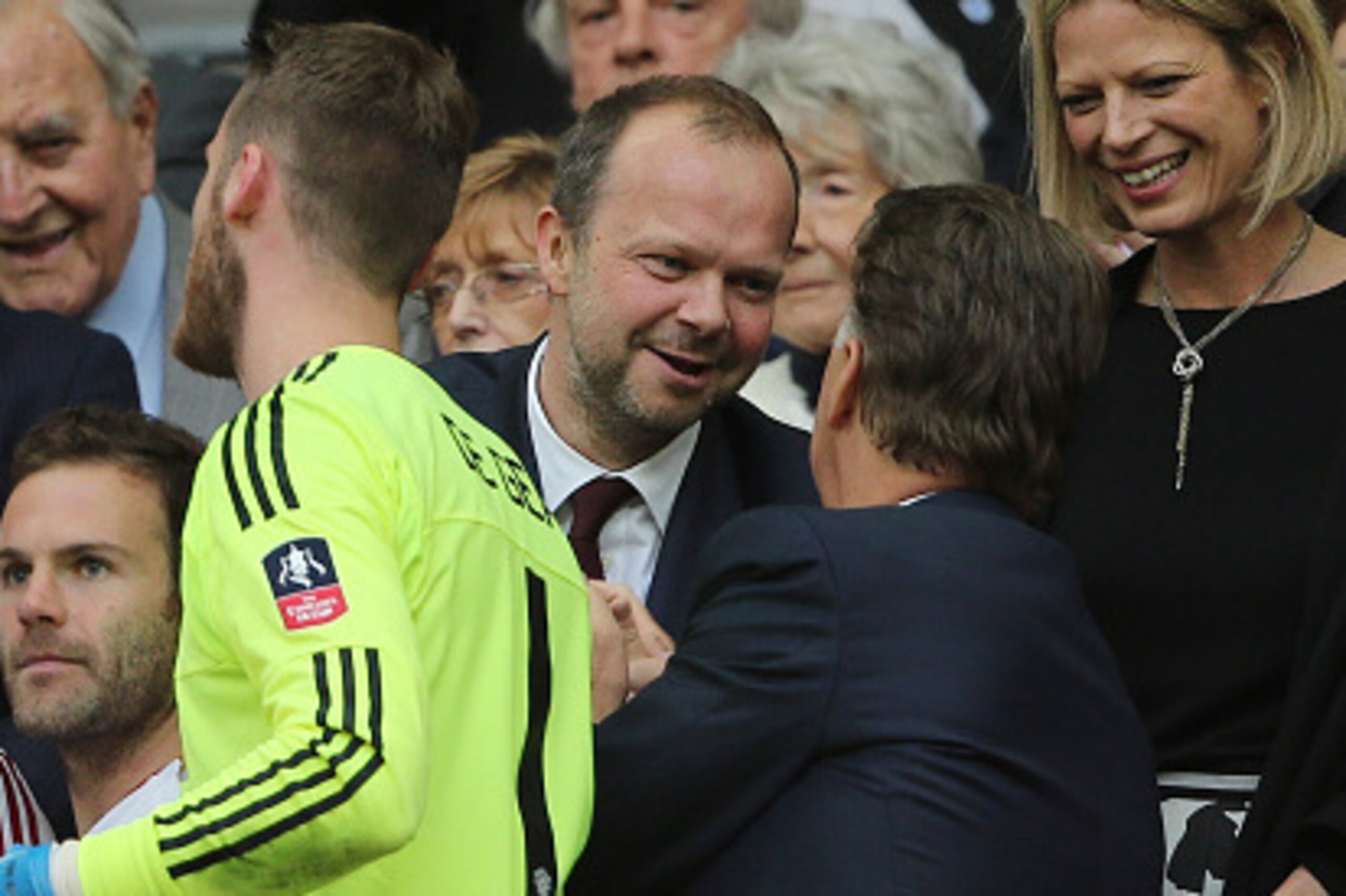 LONDON, ENGLAND - MAY 21: LONDON, ENGLAND - MAY 21: Ed Woodward the executive vice-chairman of Manchester United greets Louis van Gaal Manager / head coach of Manchester United and Ryan Giggs the Assistant Manager of Manchester during the trophy presentat