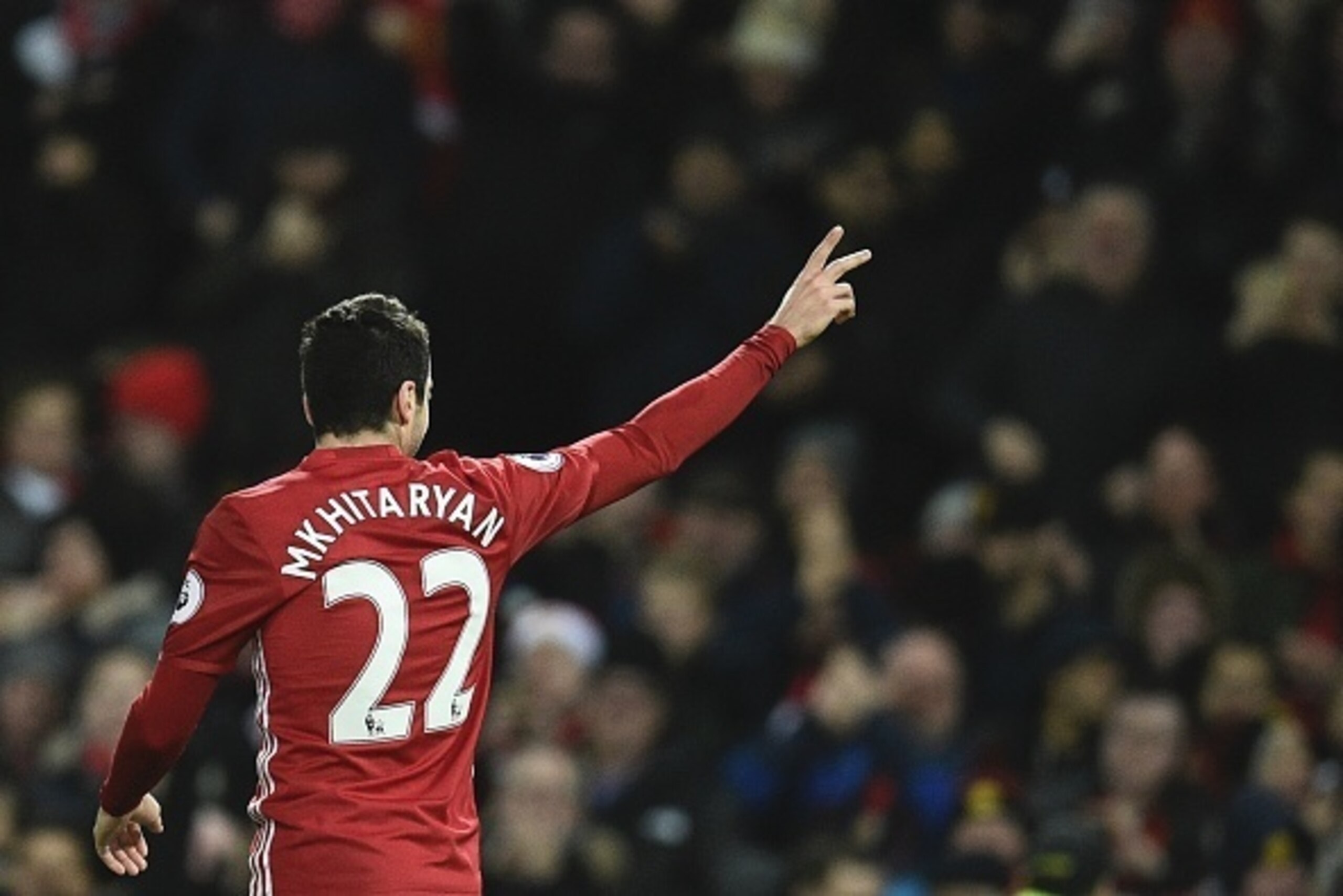 Manchester United's Armenian midfielder Henrikh Mkhitaryan celebrates scoring their third goal during the English Premier League football match between Manchester United and Sunderland at Old Trafford in Manchester, north west England, on December 26, 201
