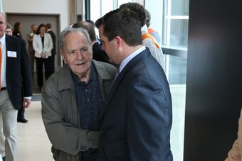 Manning with UT sports information director Ryan Robinson (right)