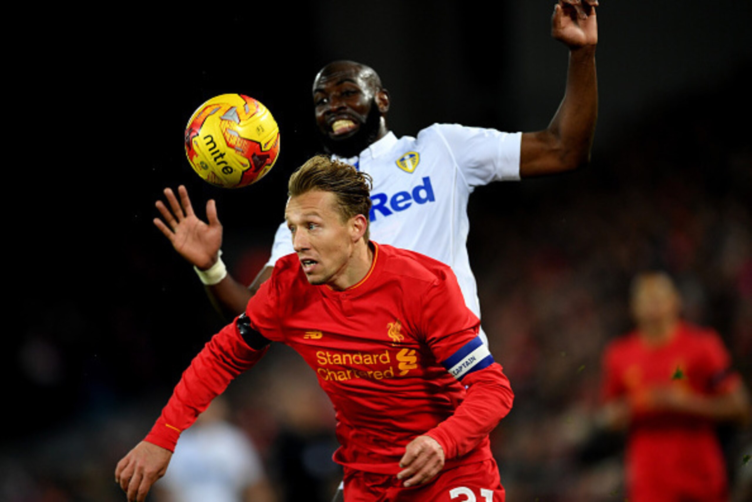 LIVERPOOL, ENGLAND - NOVEMBER 29: Lucas Leiva of Liverpool beats Souleymane Doukara of Leeds United to the ball during the EFL Cup Quarter-Final match between Liverpool and Leeds United at Anfield on November 29, 2016 in Liverpool, England. (Photo by La LIVERPOOL, ENGLAND - NOVEMBER 29: Lucas Leiva of Liverpool beats Souleymane Doukara of Leeds United to the ball during the EFL Cup Quarter-Final match between Liverpool and Leeds United at Anfield on November 29, 2016 in Liverpool, England. (Photo by La