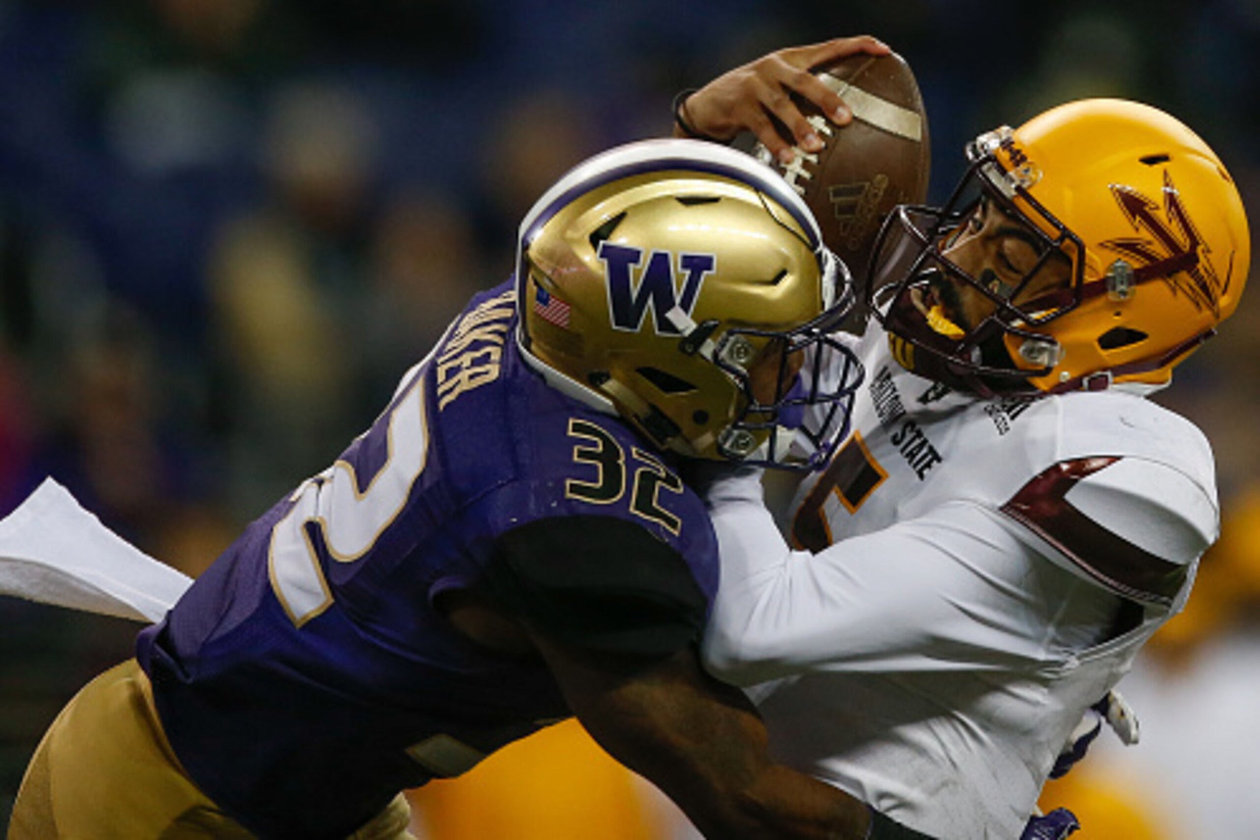 SEATTLE, WA - NOVEMBER 19:  Quarterback Manny Wilkins #5 of the Arizona State Sun Devils is sacked by defensive back Budda Baker #32 of the Washington Huskies on November 19, 2016 at Husky Stadium in Seattle, Washington. The Huskies defeated the Sun Devil