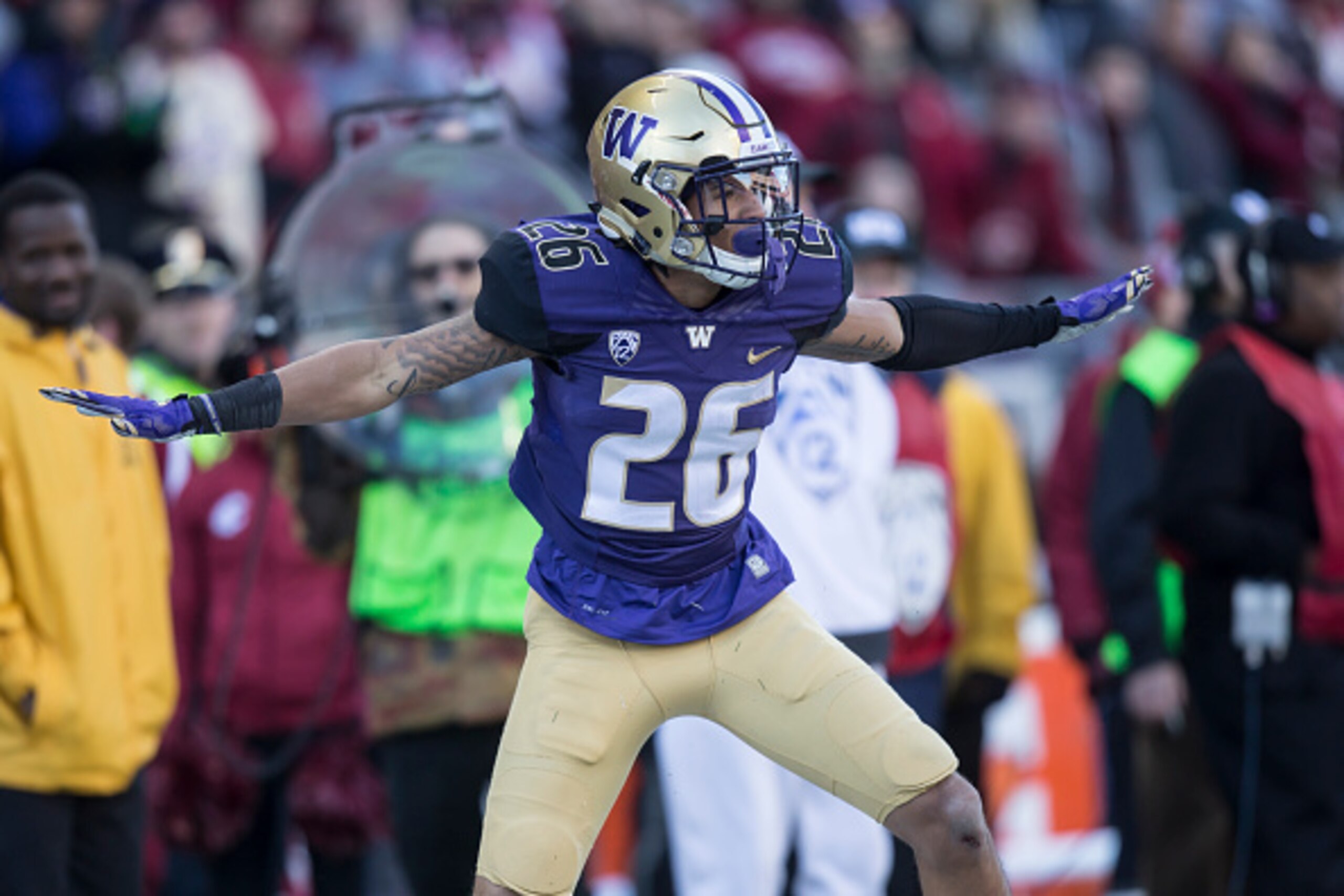 SEATTLE, WA - NOVEMBER 27: Defensive back Sidney Jones #26 of the Washington Huskies celebrates an in incomplete pass during the first half of play against the Washington State Cougars during a football game at Husky Stadium on November 27, 2015 in Seattl