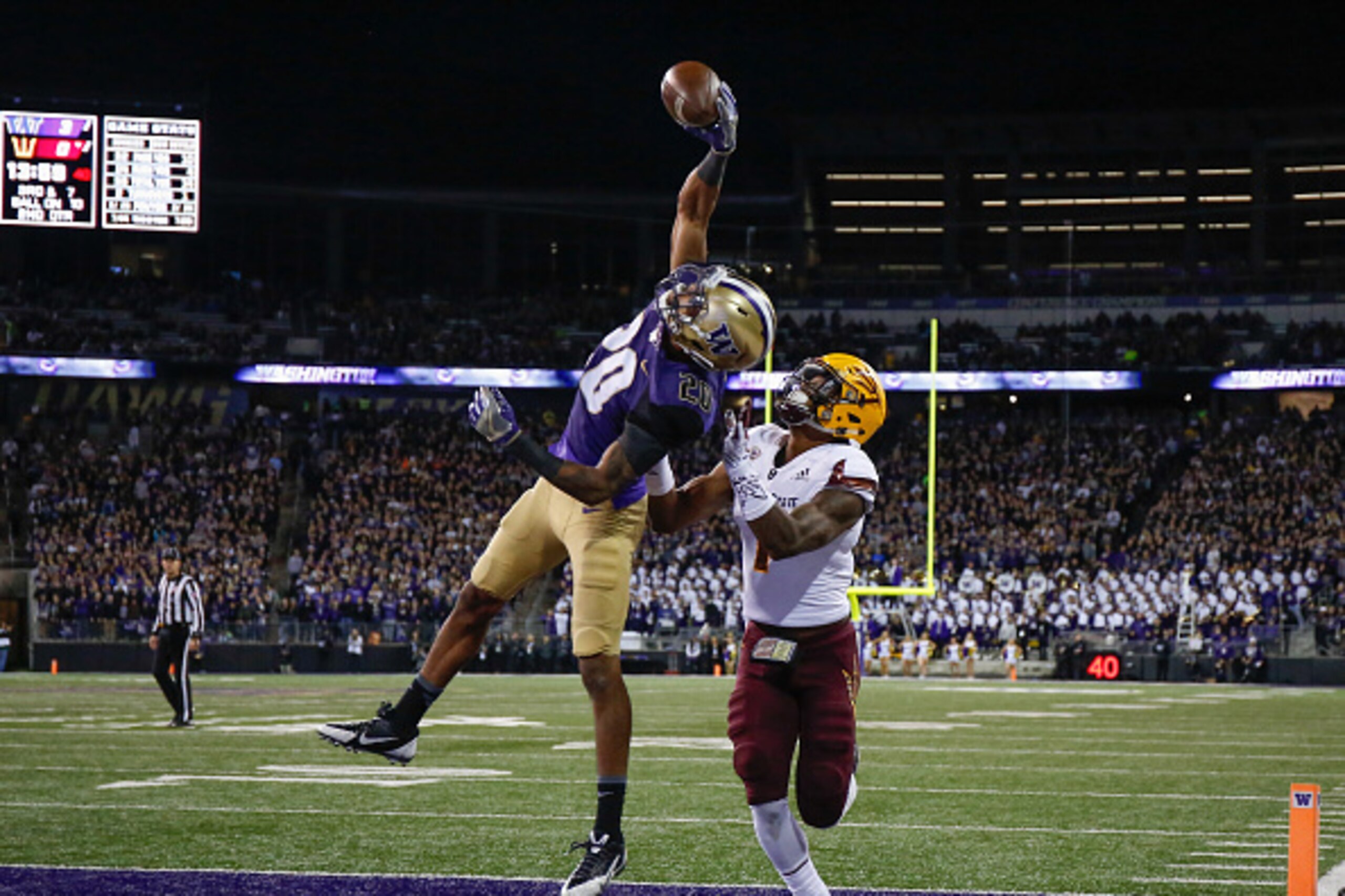 SEATTLE, WA - NOVEMBER 19:  Defensive back Kevin King #20 of the Washington Huskies makes an interception in the end zone against wide receiver N'Keal Harry #1 of the Arizona State Sun Devils on November 19, 2016 at Husky Stadium in Seattle, Washington.  