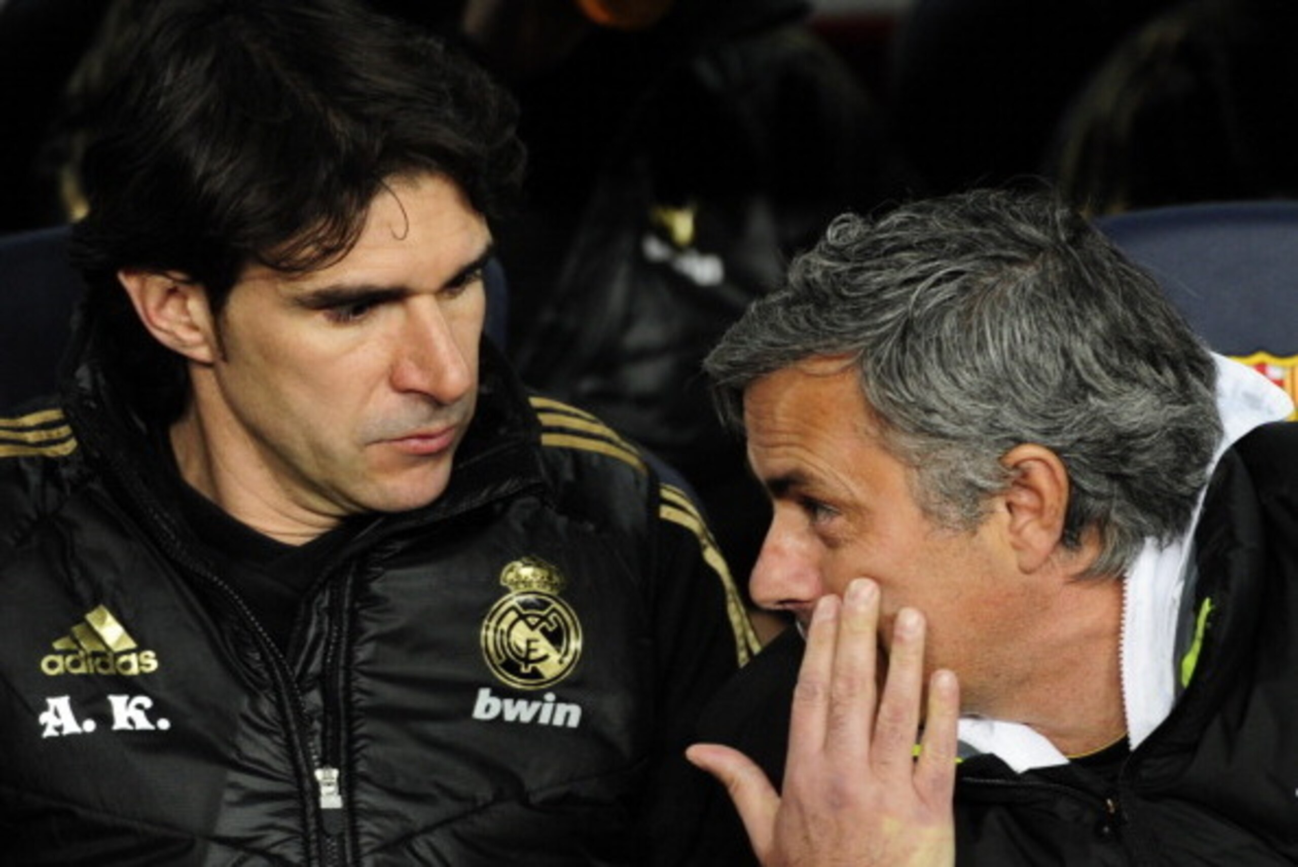 Real Madrid's Portuguese coach Jose Mourinho (R) chats with Real Madrid's assistant coach Aitor Karanka (L) during the second leg of the Spanish Cup quarter-final 'El clasico' football match Barcelona vs Real Madrid at the Camp Nou stadium in Barcelona on