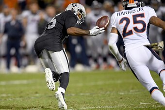 OAKLAND, CA - NOVEMBER 06:  Michael Crabtree #15 of the Oakland Raiders catches a pass against the Denver Broncos in the fourth quarter of an NFL football game at the Oakland-Alameda County Coliseum on November 6, 2016 in Oakland, California.  (Photo by T
