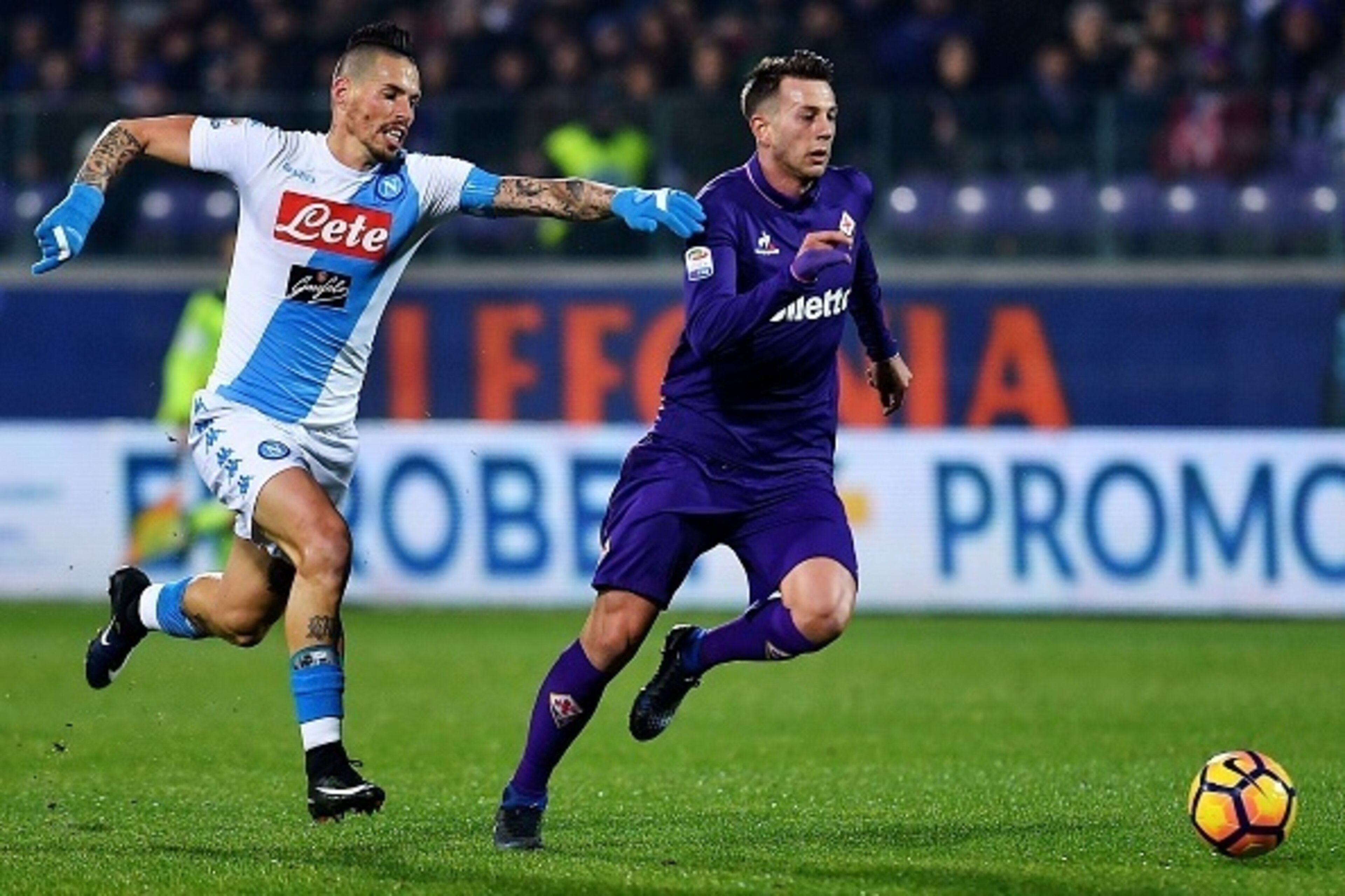 Napoli's Slovakian midfielder Marek Hamsik (L) vies for the ball with Fiorentina's Italian forward Federico Bernardeschi during the Italian Serie A football match between Fiorentina and Napoli on December 22, 201,6 at Artemio Franchi stadium in Floren Napoli's Slovakian midfielder Marek Hamsik (L) vies for the ball with Fiorentina's Italian forward Federico Bernardeschi during the Italian Serie A football match between Fiorentina and Napoli on December 22, 201,6 at Artemio Franchi stadium in Floren
