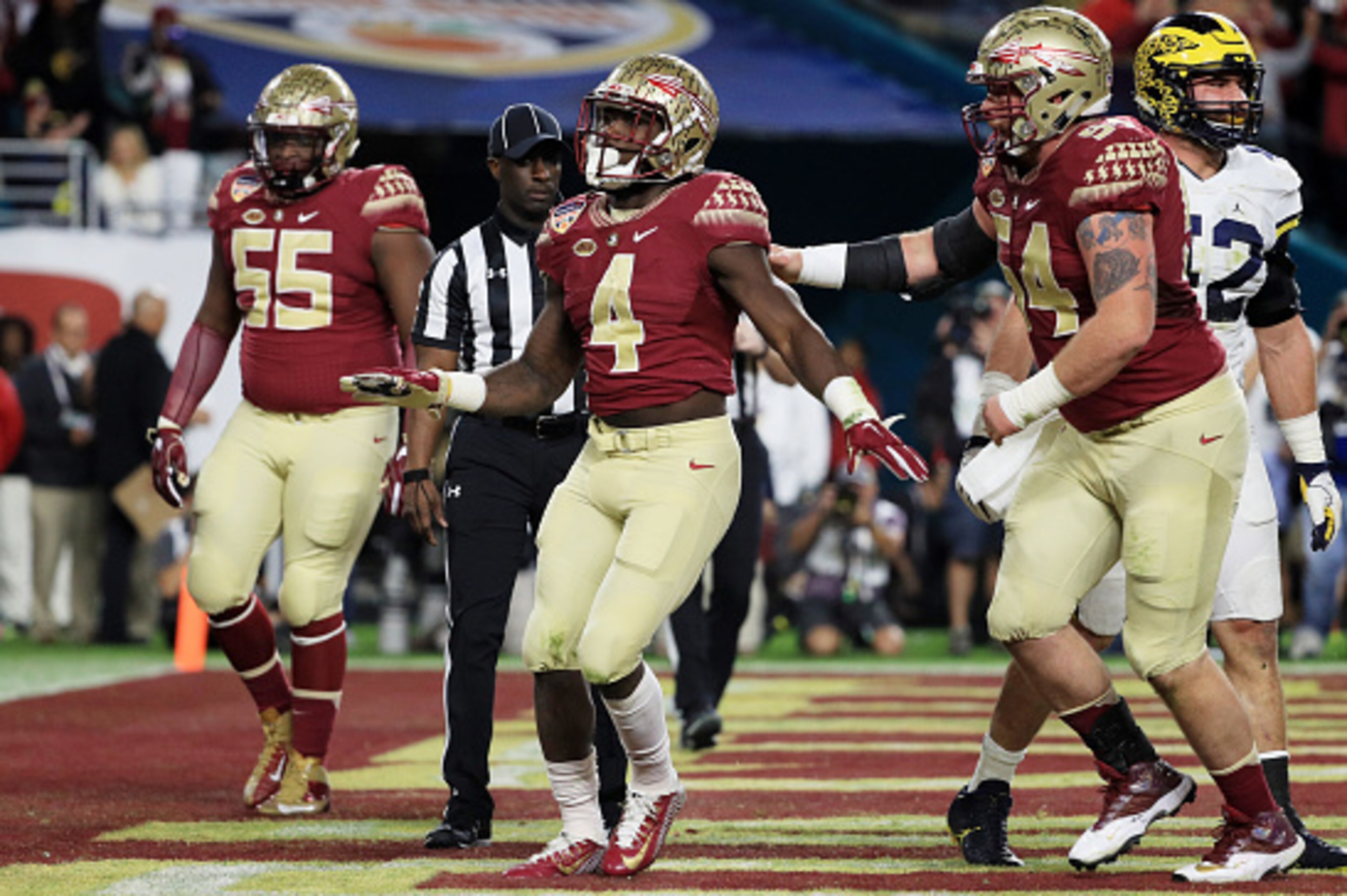 MIAMI GARDENS, FL - DECEMBER 30:  Dalvin Cook #4 of the Florida State Seminoles celebrates his touchdown in the first quarter against the Michigan Wolverines during the Capitol One Orange Bowl at Sun Life Stadium on December 30, 2016 in Miami Gardens, Flo
