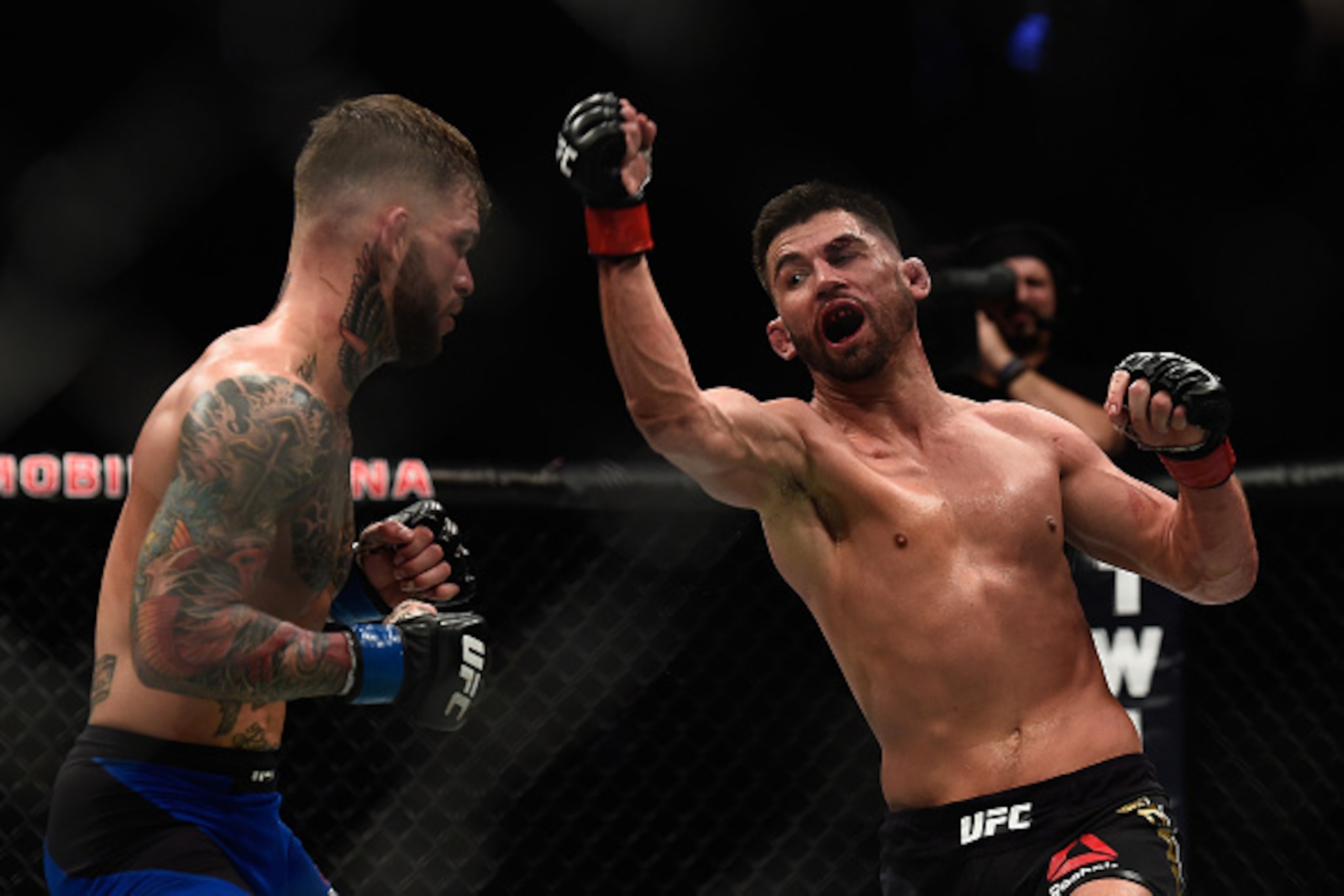 LAS VEGAS, NV - DECEMBER 30: (R-L) Dominick Cruz punches Cody Garbrandt during the UFC 207 event at T-Mobile Arena on December 30, 2016 in Las Vegas, Nevada.  (Photo by Brandon Magnus/Zuffa LLC/Zuffa LLC via Getty Images)
