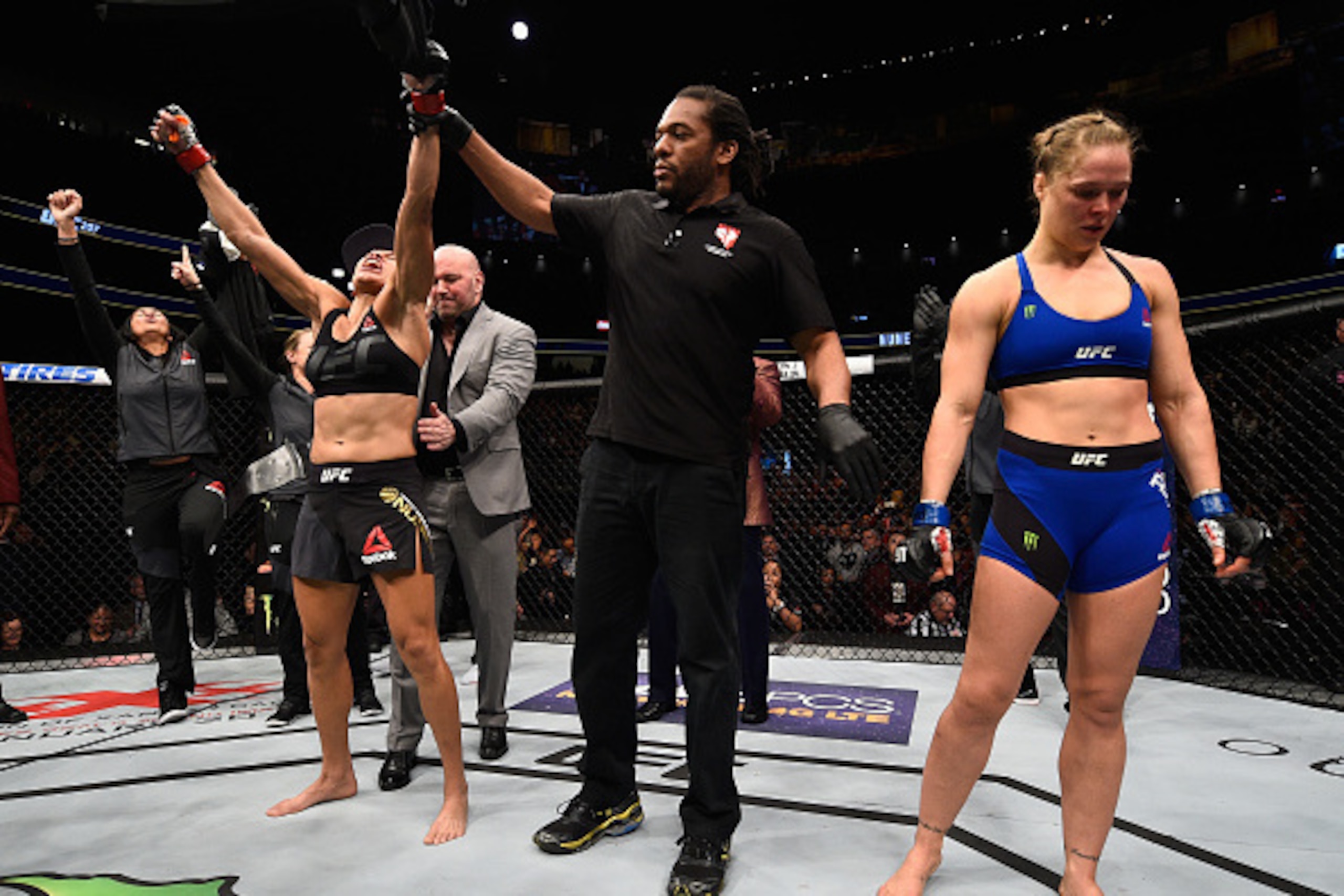 LAS VEGAS, NV - DECEMBER 30:  Amanda Nunes of Brazil (left) reacts to her victory over Ronda Rousey (right) in their UFC women's bantamweight championship bout during the UFC 207 event at T-Mobile Arena on December 30, 2016 in Las Vegas, Nevada.  (Photo b