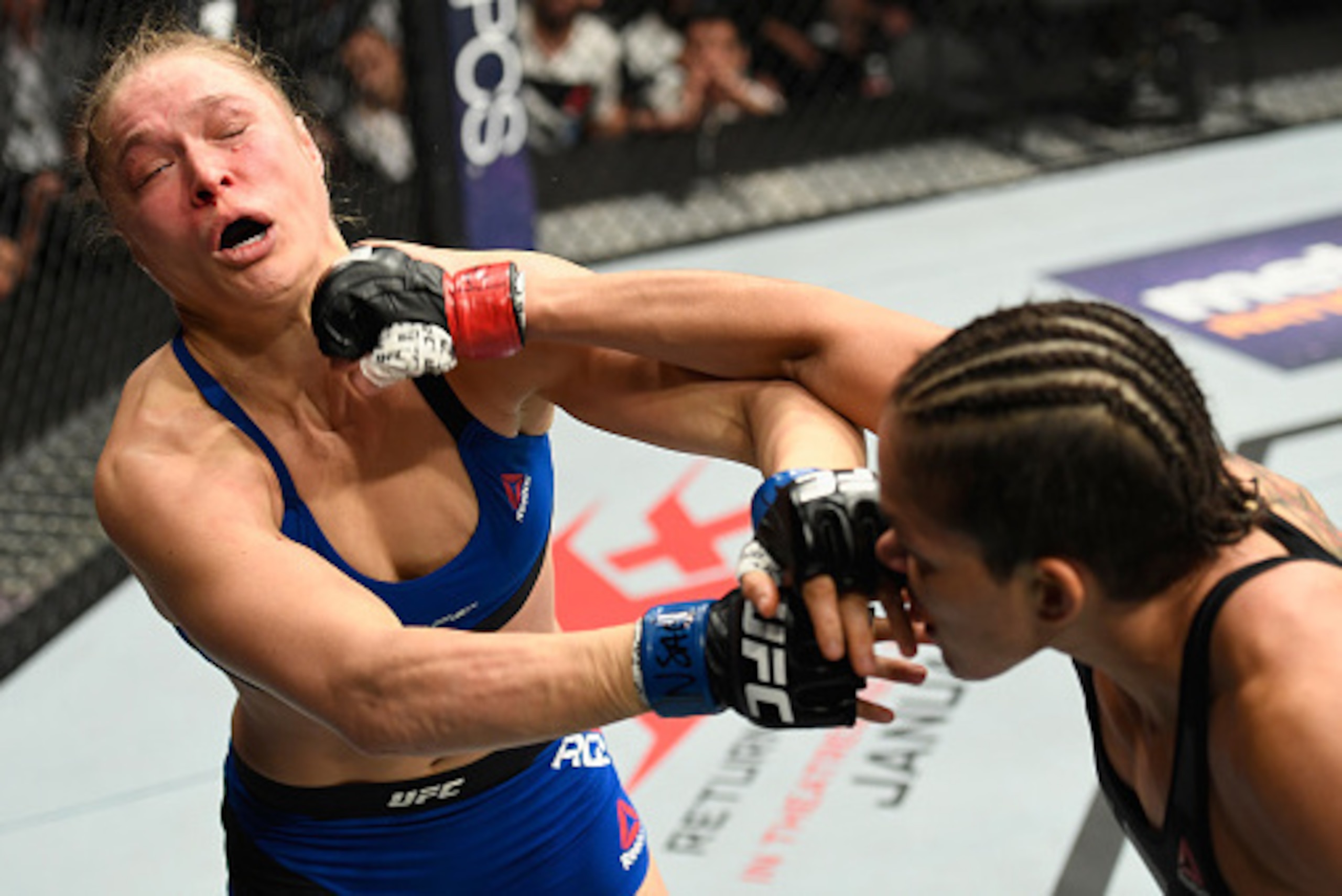 LAS VEGAS, NV - DECEMBER 30: (R-L) Amanda Nunes of Brazil punches Ronda Rousey in their UFC women's bantamweight championship bout during the UFC 207 event at T-Mobile Arena on December 30, 2016 in Las Vegas, Nevada.  (Photo by Josh Hedges/Zuffa LLC/Zuffa