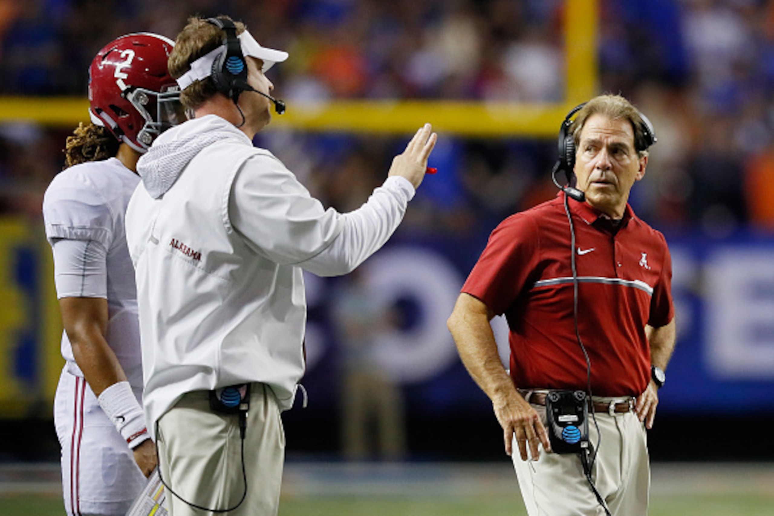ATLANTA, GA - DECEMBER 03:  Head coach Nick Saban, and Offensive Coordinator Quarterbacks Lane Kiffin talk to Jalen Hurts #2 of the Alabama Crimson Tide in the second half against the Florida Gators during the SEC Championship game at the Georgia Dome on 
