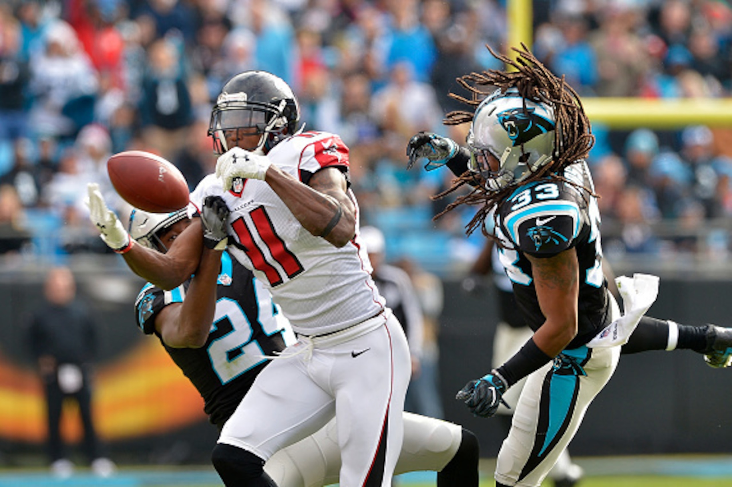 CHARLOTTE, NC - DECEMBER 24:  Tre Boston #33 and teammate James Bradberry #24 of the Carolina Panthers defend a pass to Julio Jones #11 of the Atlanta Falcons in the 1st quarter during the game at Bank of America Stadium on December 24, 2016 in Charlotte,