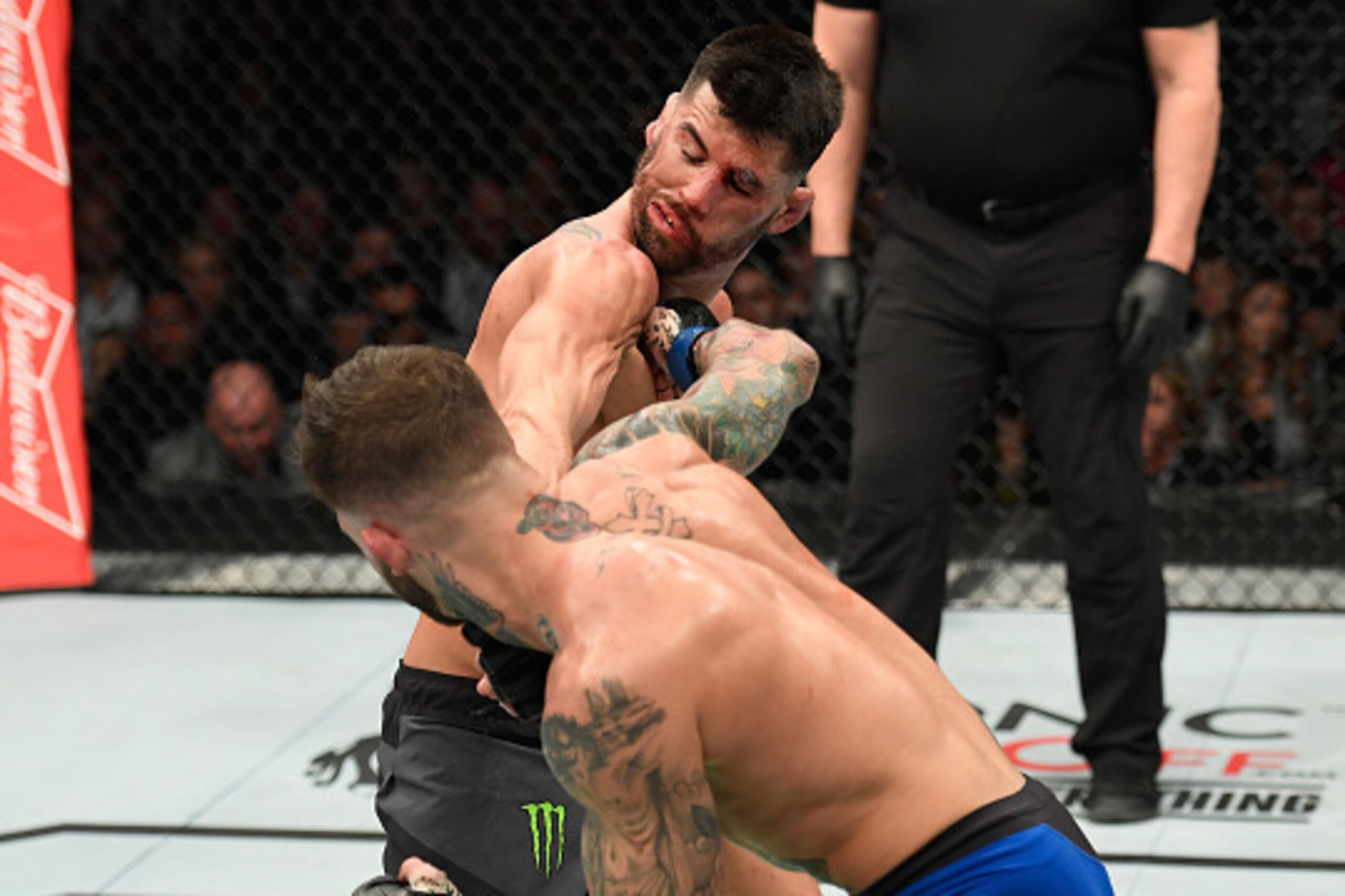 LAS VEGAS, NV - DECEMBER 30: Cody Garbrandt (front) punches Dominick Cruz in their UFC bantamweight championship bout during the UFC 207 event at T-Mobile Arena on December 30, 2016 in Las Vegas, Nevada.  (Photo by Josh Hedges/Zuffa LLC/Zuffa LLC via Gett