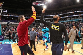 CHARLOTTE, NC - DECEMBER 31: Kevin Love #0 and LeBron James #23 of the Cleveland Cavaliers are introduced before the game against the Charlotte Hornetson December 31, 2016 at Spectrum Center in Charlotte, North Carolina. NOTE TO USER: User expressly ackno