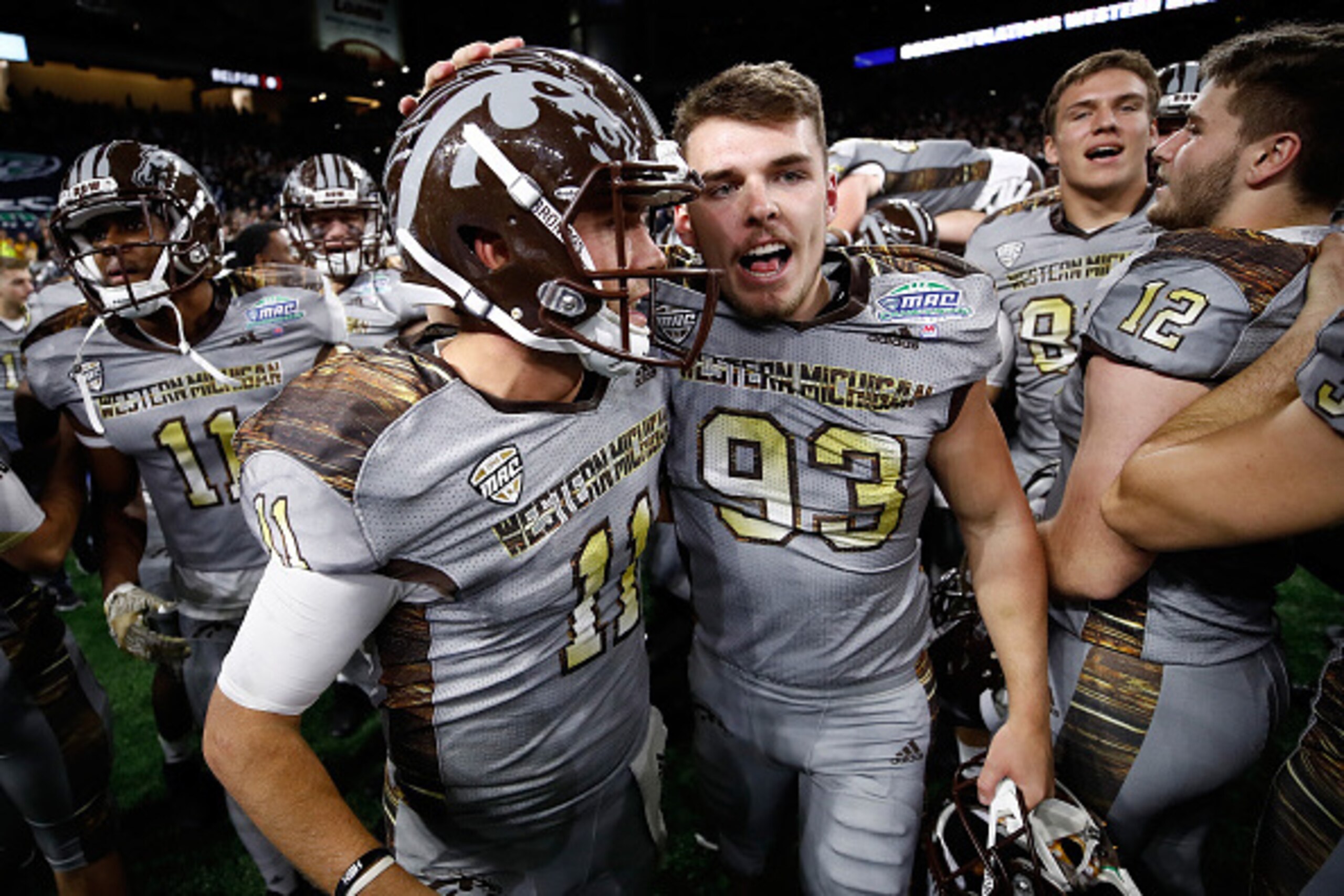 DETROIT, MI - DECEMBER 02: Zach Terrell #11 of the Western Michigan Broncos celebrates winning the MAC Championship 29-23 over the Ohio Bobcats with Austin Regan #93 on December 2, 2016 at Ford Field in Detroit, Michigan. (Photo by Gregory Shamus/Getty Im