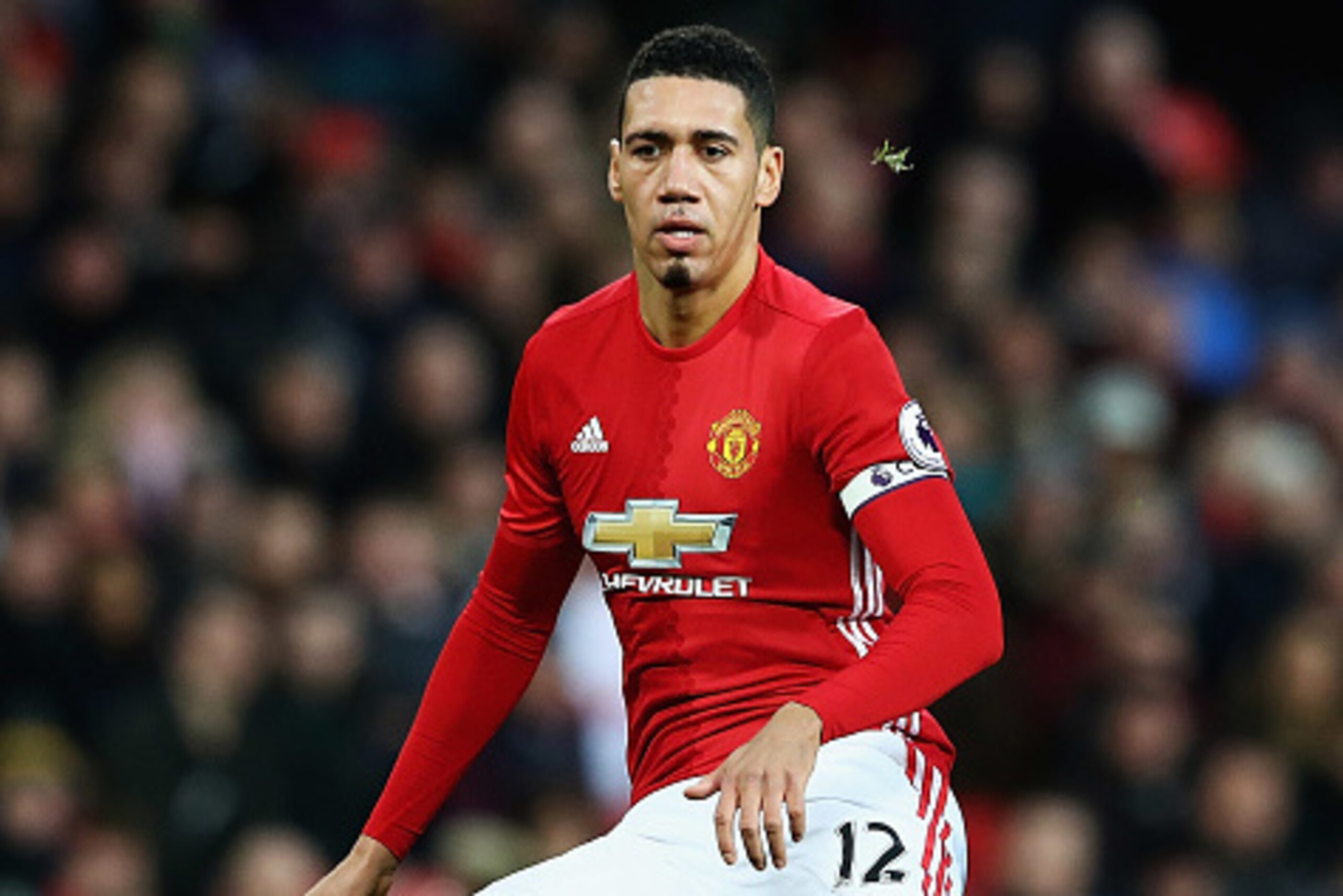 MANCHESTER, ENGLAND - DECEMBER 31:  Chris Smalling of Manchester United looks on during the Premier League match between Manchester United and Middlesbrough at Old Trafford on December 31, 2016 in Manchester, England.  (Photo by Matthew Lewis/Getty Images