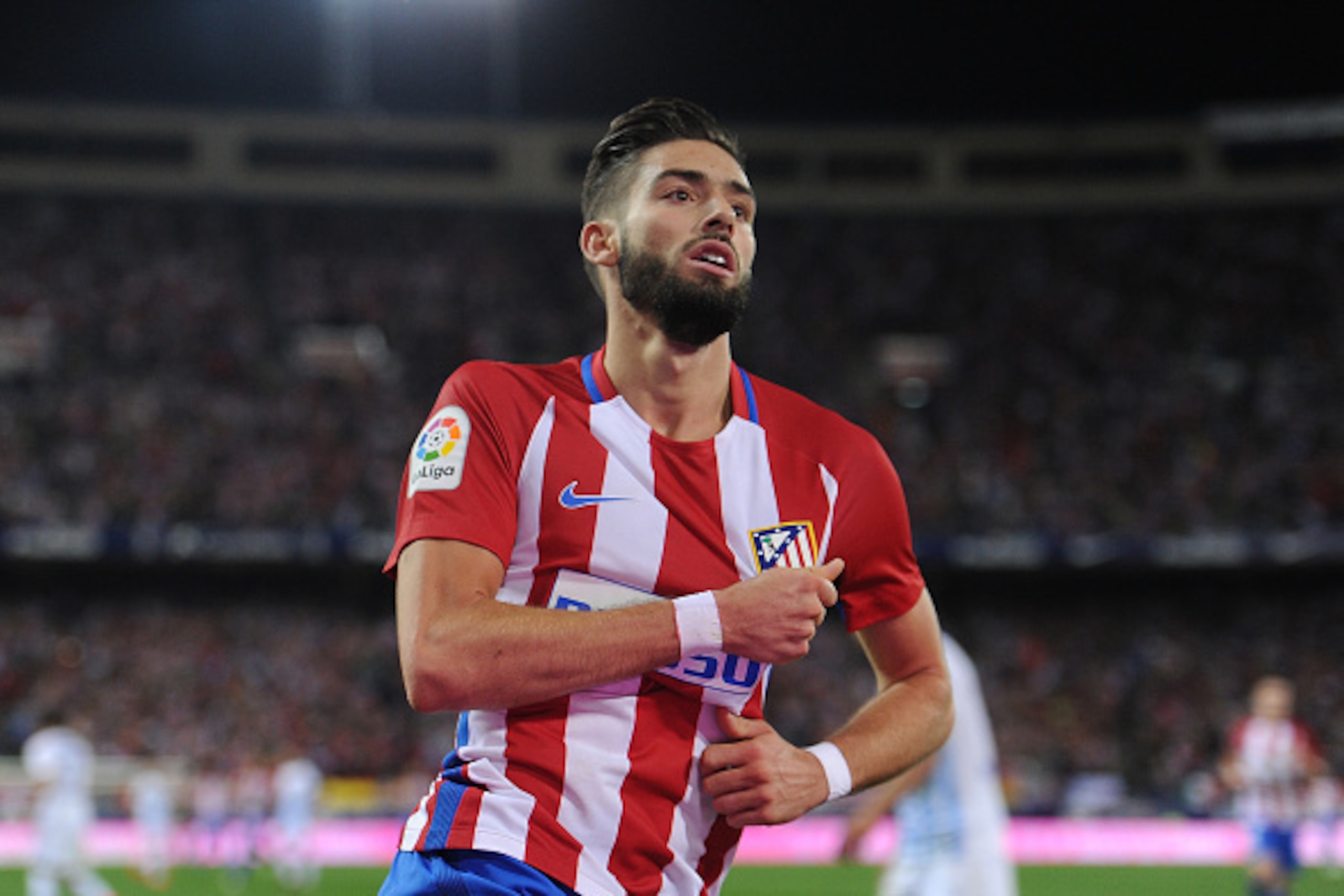 MADRID, SPAIN - OCTOBER 29:   Yannick Carrasco of Club Atletico de Madrid celebrates after scoring his team's 4th goal during the La Liga match between Club Atletico de Madrid and Malaga CF at estadio Vicente Calderon on October 29, 2016 in Madrid, Spain.