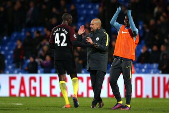 LONDON, ENGLAND - NOVEMBER 19: Man City's Manager Pep Guardiola celebrates the teams win with Yaya Toure after the whistle during the Premier League match between Crystal Palace and Manchester City at Selhurst Park on November 19, 2016 in London, England.