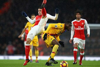 LONDON, ENGLAND - JANUARY 01:  Gabriel of Arsenal and Christian Benteke of Crystal Palace battle for the ball during the Premier League match between Arsenal and Crystal Palace at the Emirates Stadium on January 1, 2017 in London, England.  (Photo by Cliv