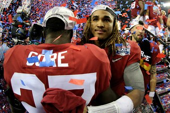 ATLANTA, GA - DECEMBER 31:  Jalen Hurts #2 of the Alabama Crimson Tide celebrates with his teammate Derrick Gore #27 after winning 24 to 7 against the Washington Huskies during the 2016 Chick-fil-A Peach Bowl at the Georgia Dome on December 31, 2016 in At